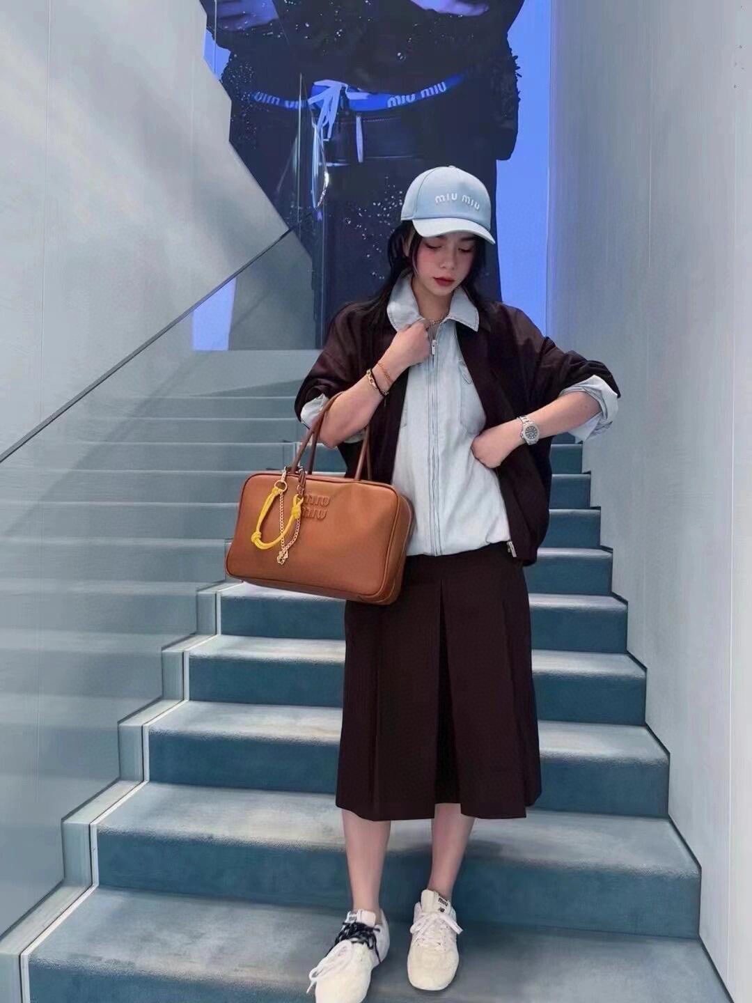 Mi dark brown utility zip-up jacketI paired withmatching tone-on-tone skirt