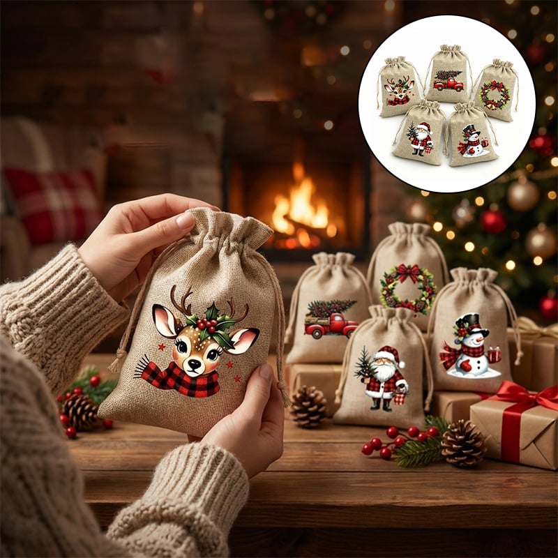 Christmas burlap gift bags displayed beside a Christmas tree