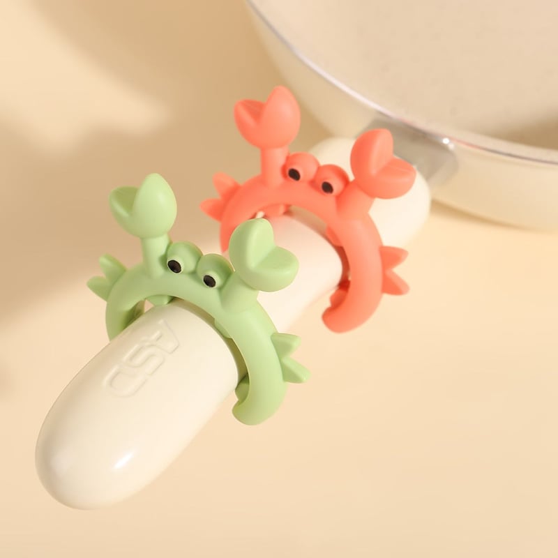 Crab shaped silicone utensil holder in use