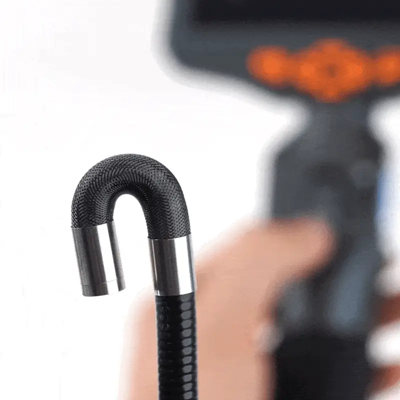 Close-up of the Mekrivo C50 braided inspection probe bent into a tight U shape
