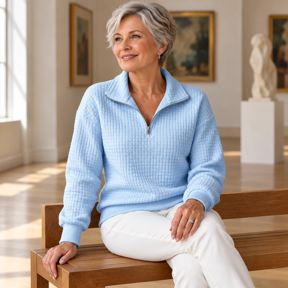 Blue waffle-textured half-zip pullover seated complete view
