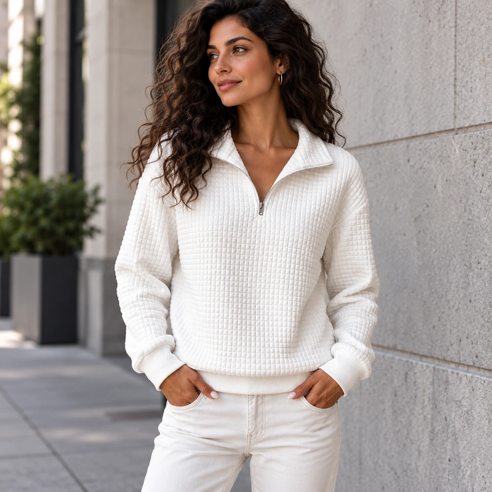 White waffle-textured half-zip pullover city editorial perspective