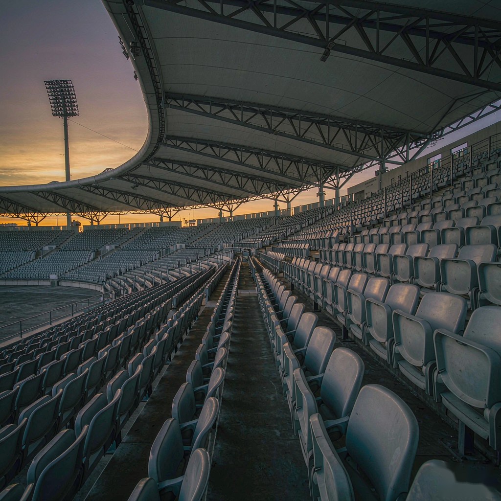 Stadium stands in low evening light