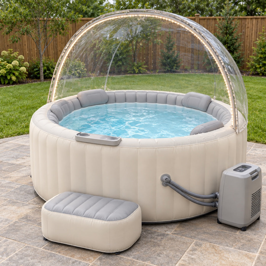 Winter Edition hot tub in daylight — the clear dome canopy with its LED strip, headrests, drink ledge, step and heater pump