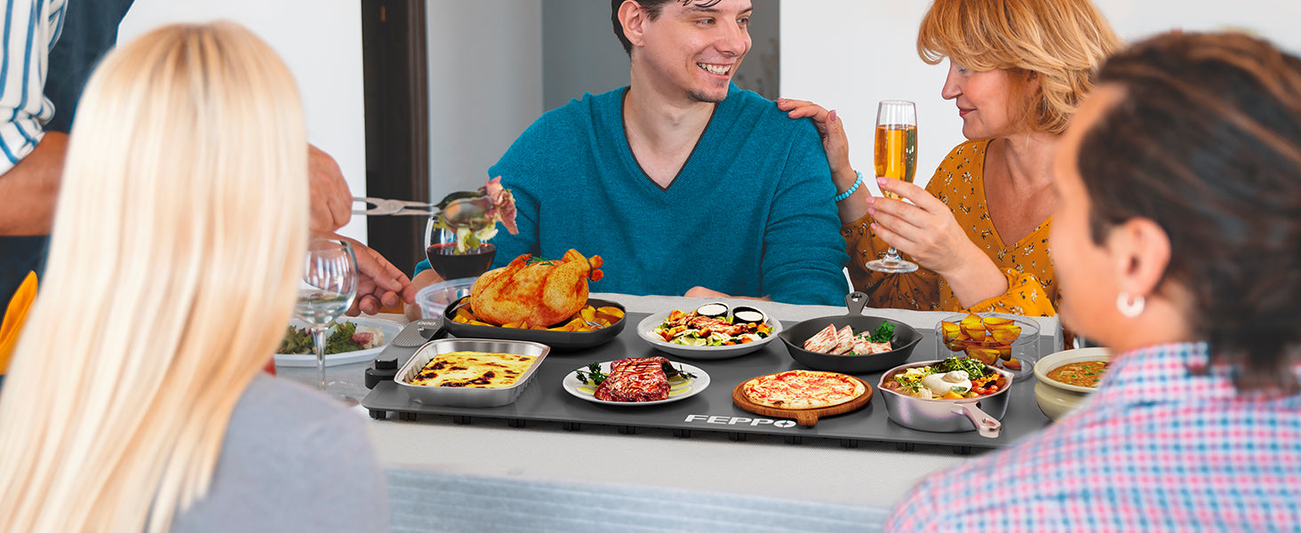 Large warming mat holding several serving dishes