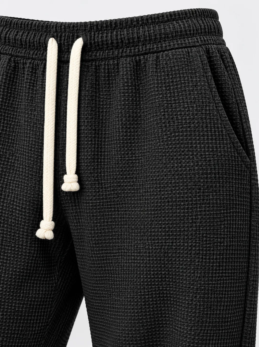 Drawstring waistband and side pocket detail