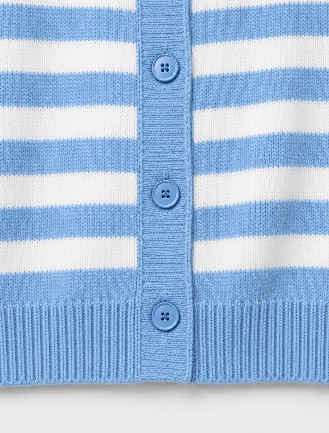 Button placket and rib-knit hem detail