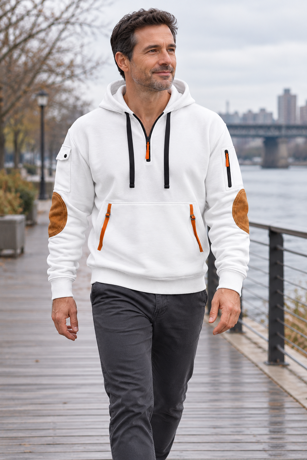 Half zip · drawstring hood · contrast pocket trim in a natural everyday setting