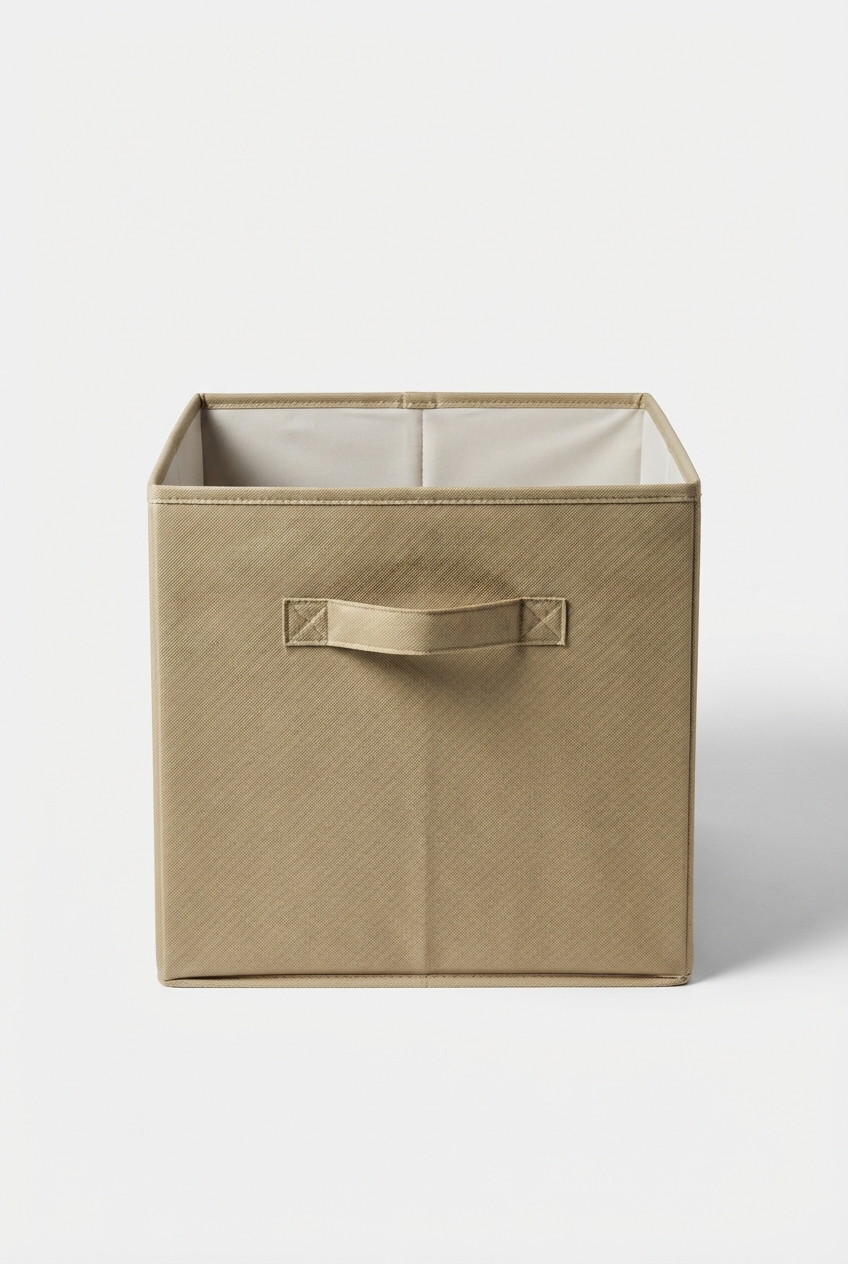 Khaki foldable storage bin standing on matte off-white surface