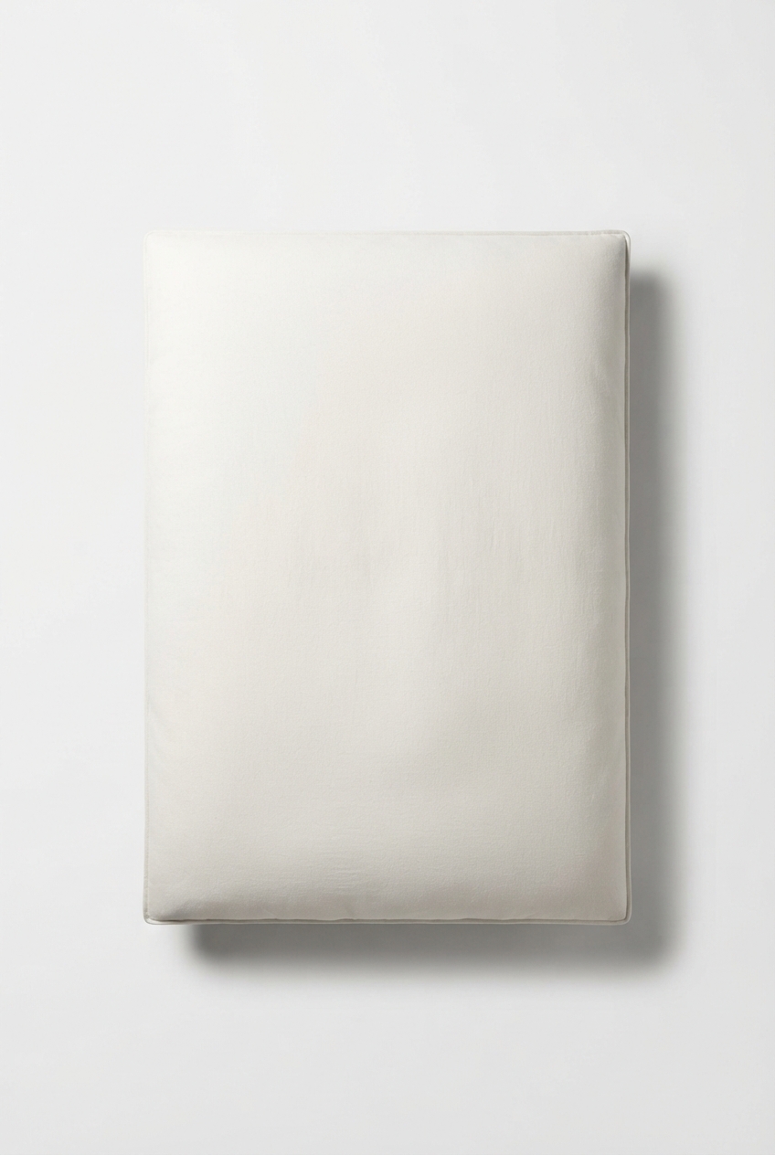 Ivory queen comforter neatly folded in a minimalist style
