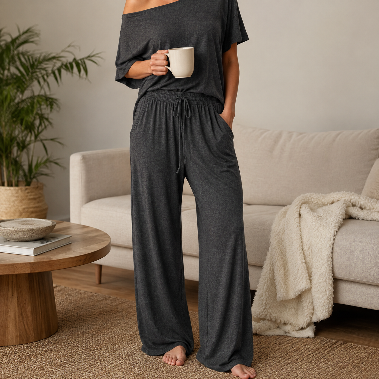 Dark gray off-shoulder lounge set at home, cropped below the head
