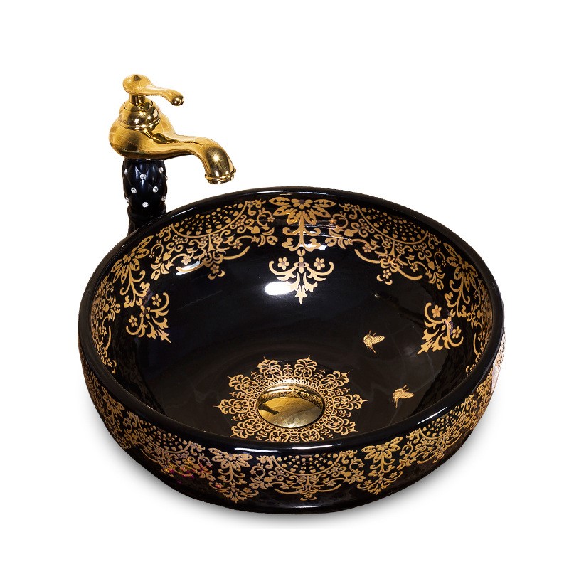Black washbasin with gold patterns