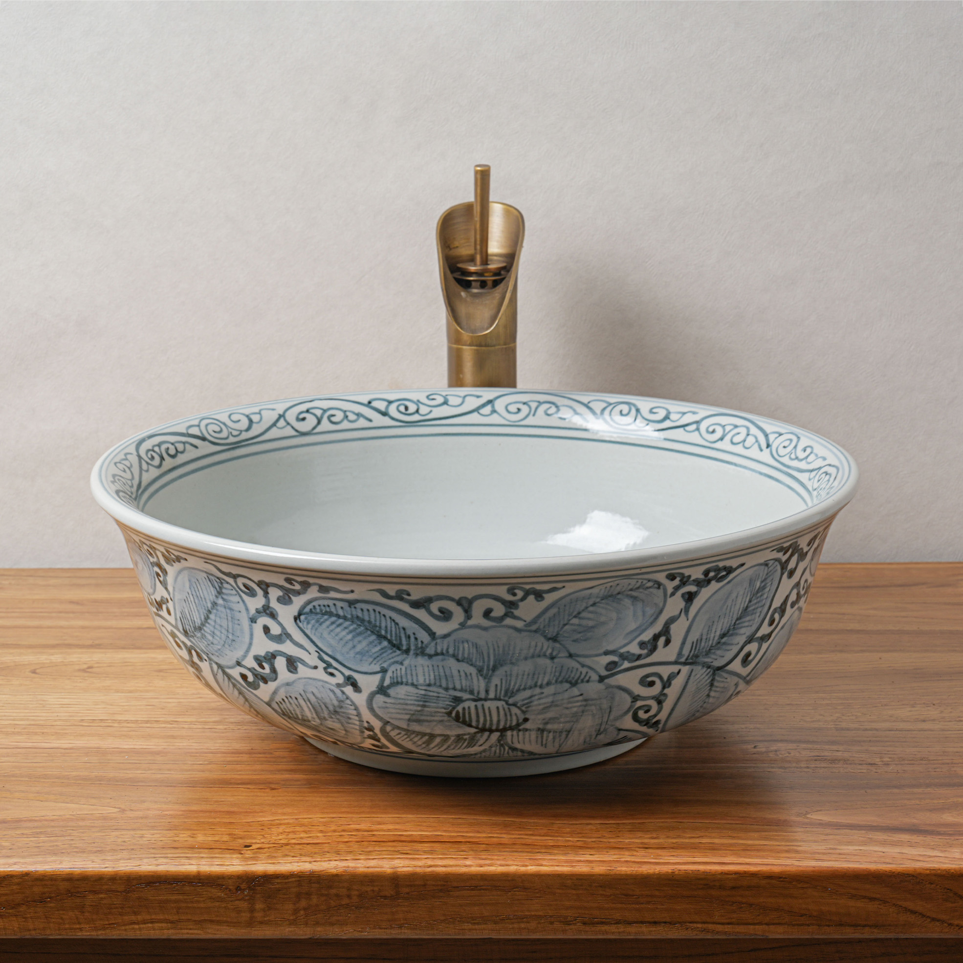 Round hand-painted ceramic washbasin