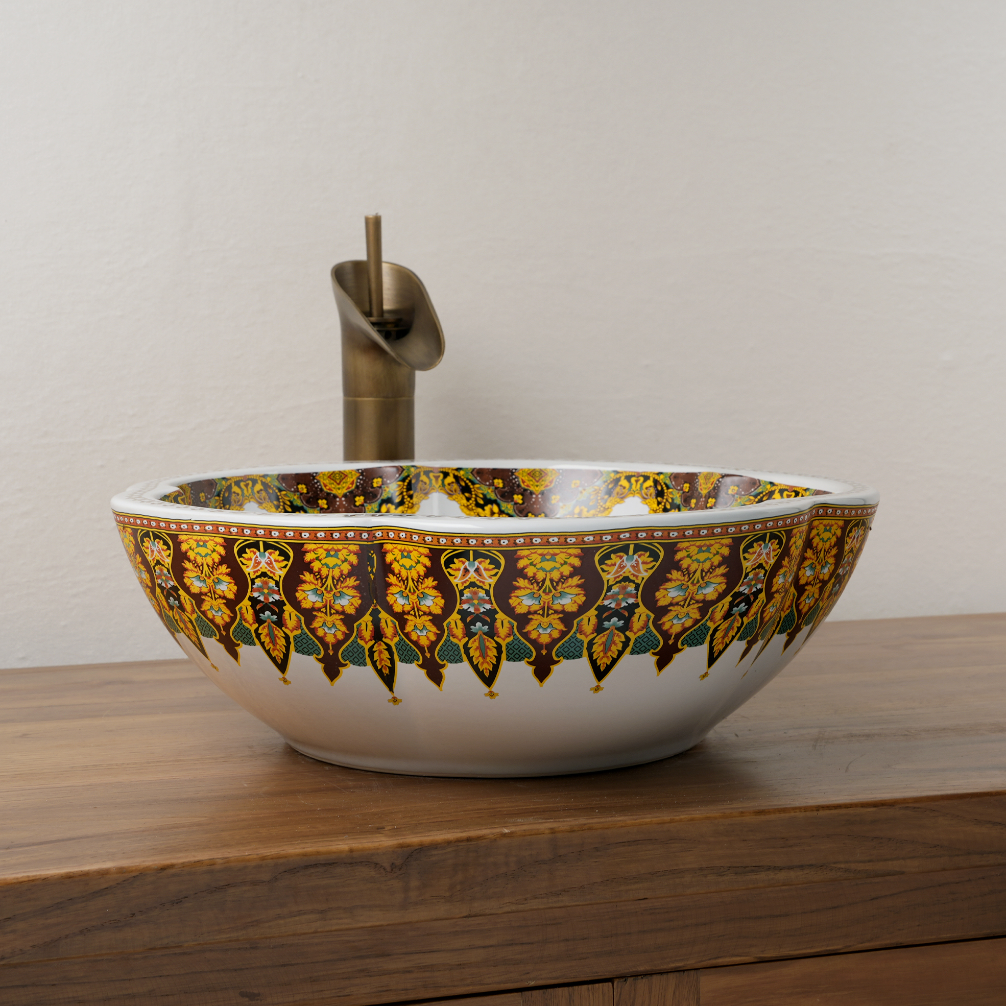 Ceramic washbasin with a yellow and white floral print