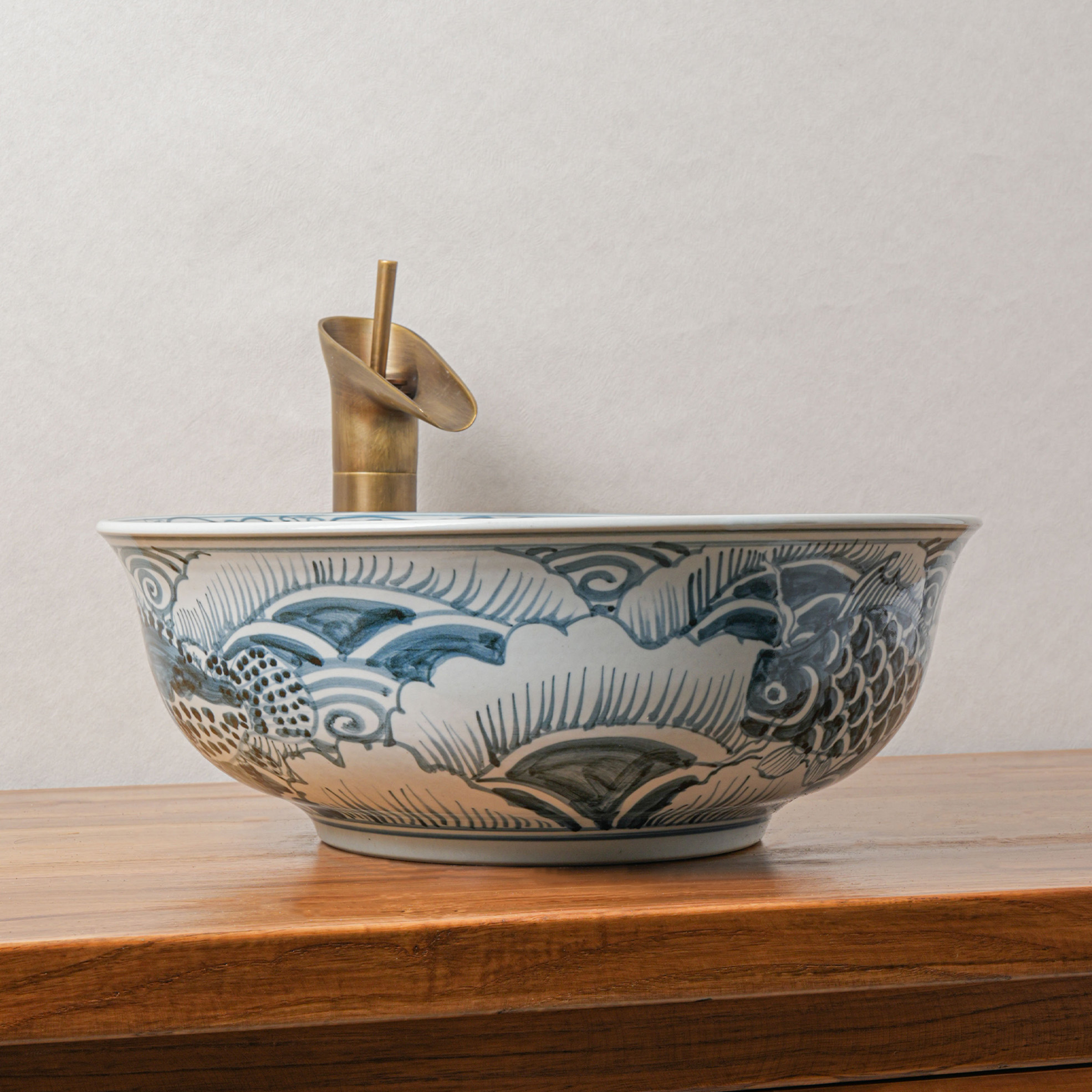 Round hand-painted ceramic washbasin