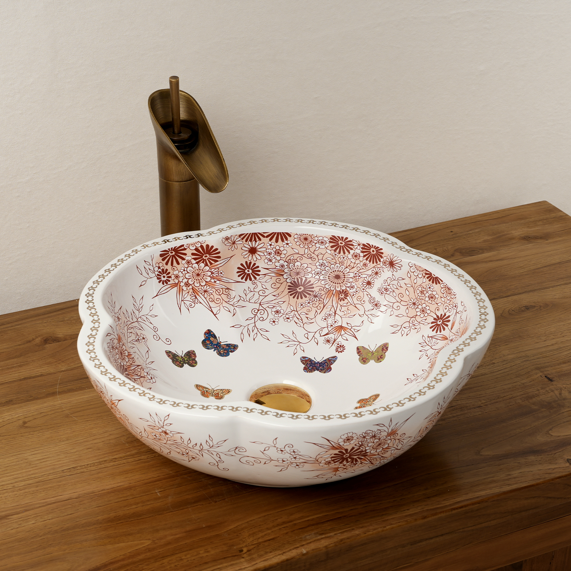 Ceramic washbasin with a pink and white floral print