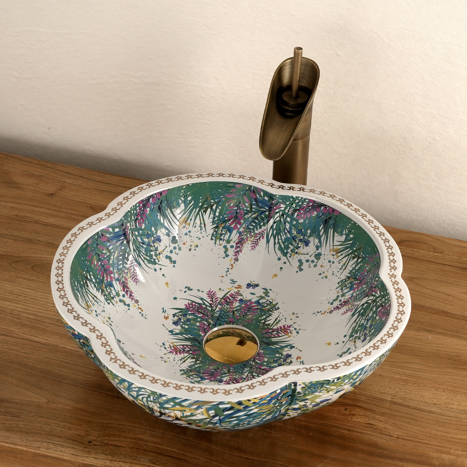 Ceramic washbasin with a green and white floral print