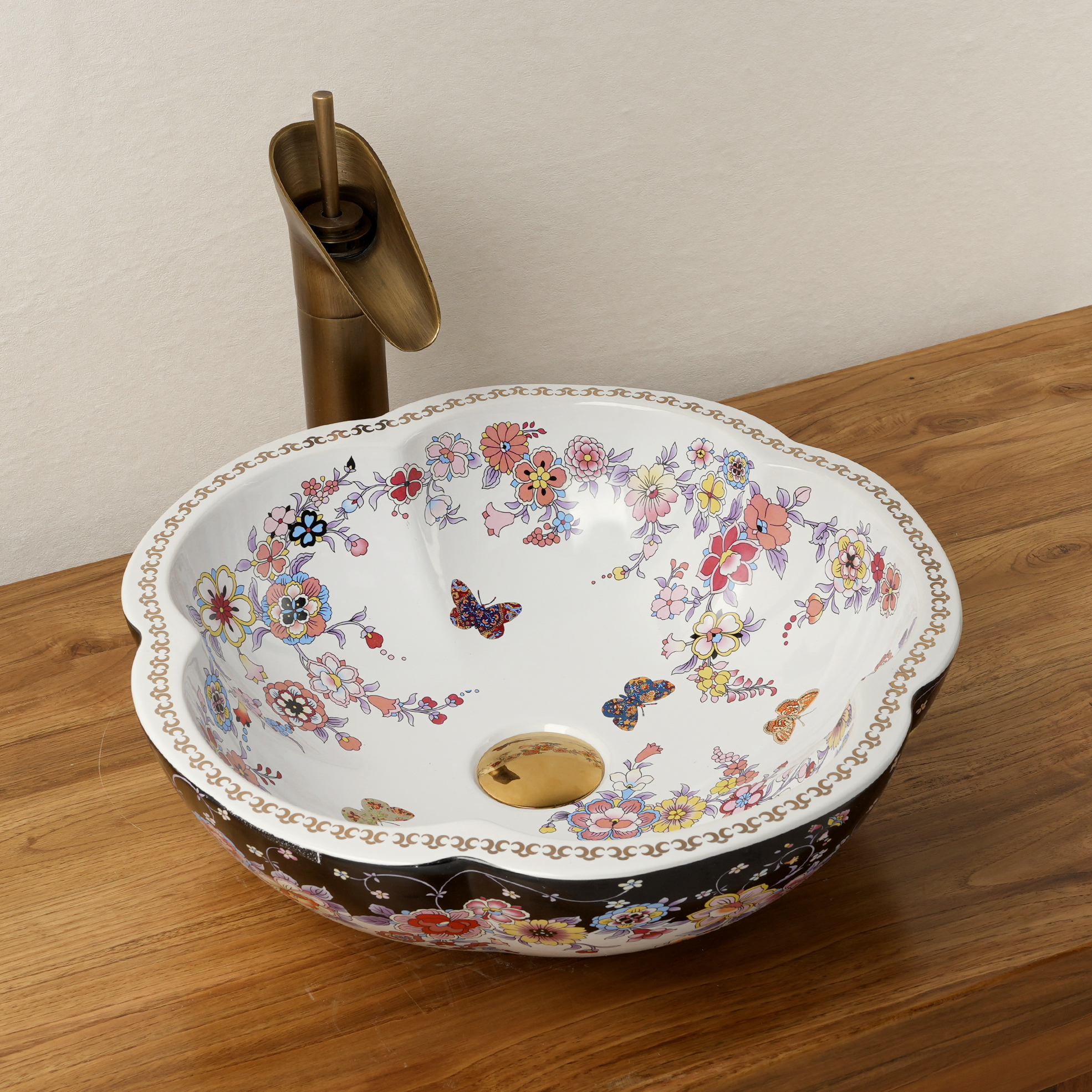 Ceramic washbasin with black and white floral print