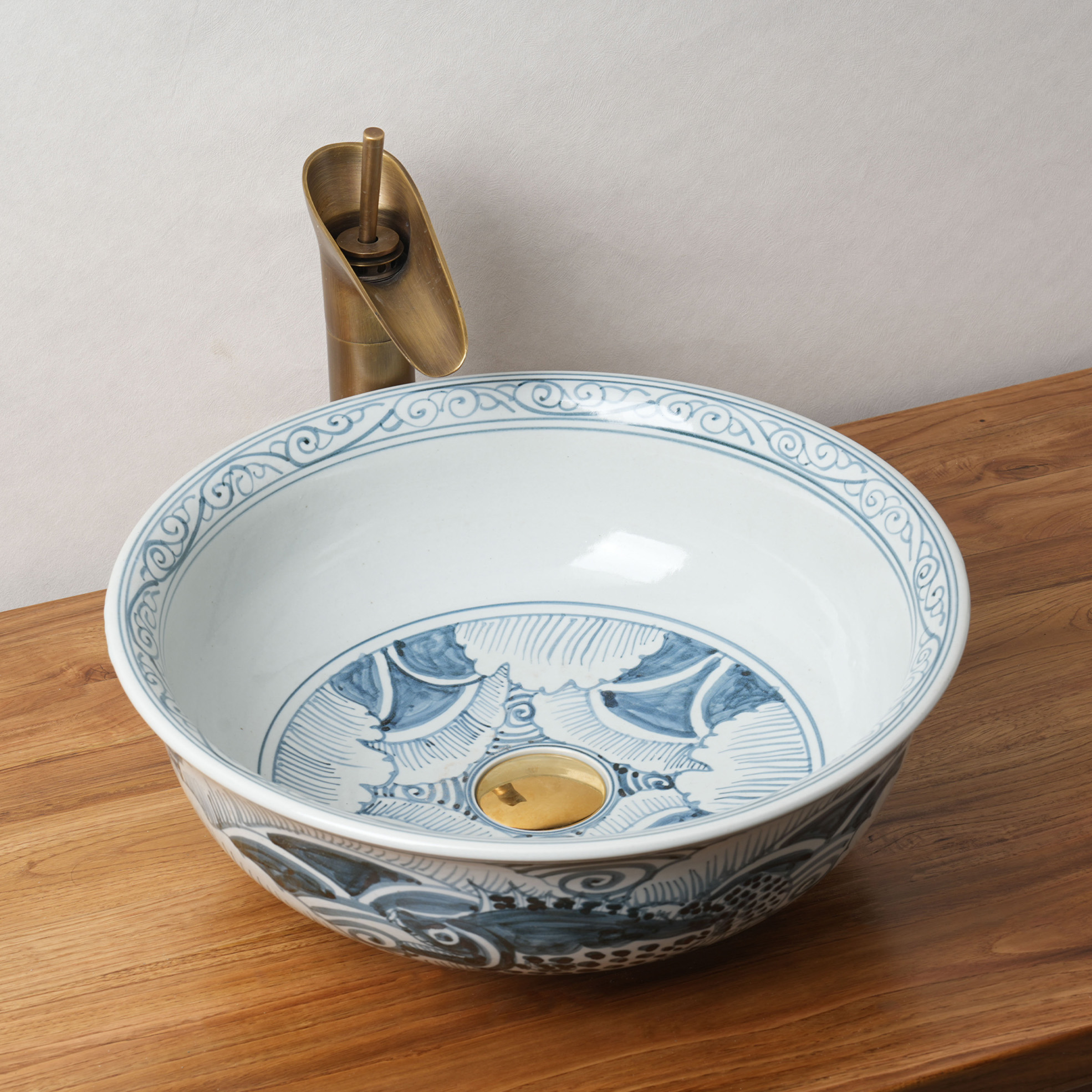 Round hand-painted ceramic washbasin