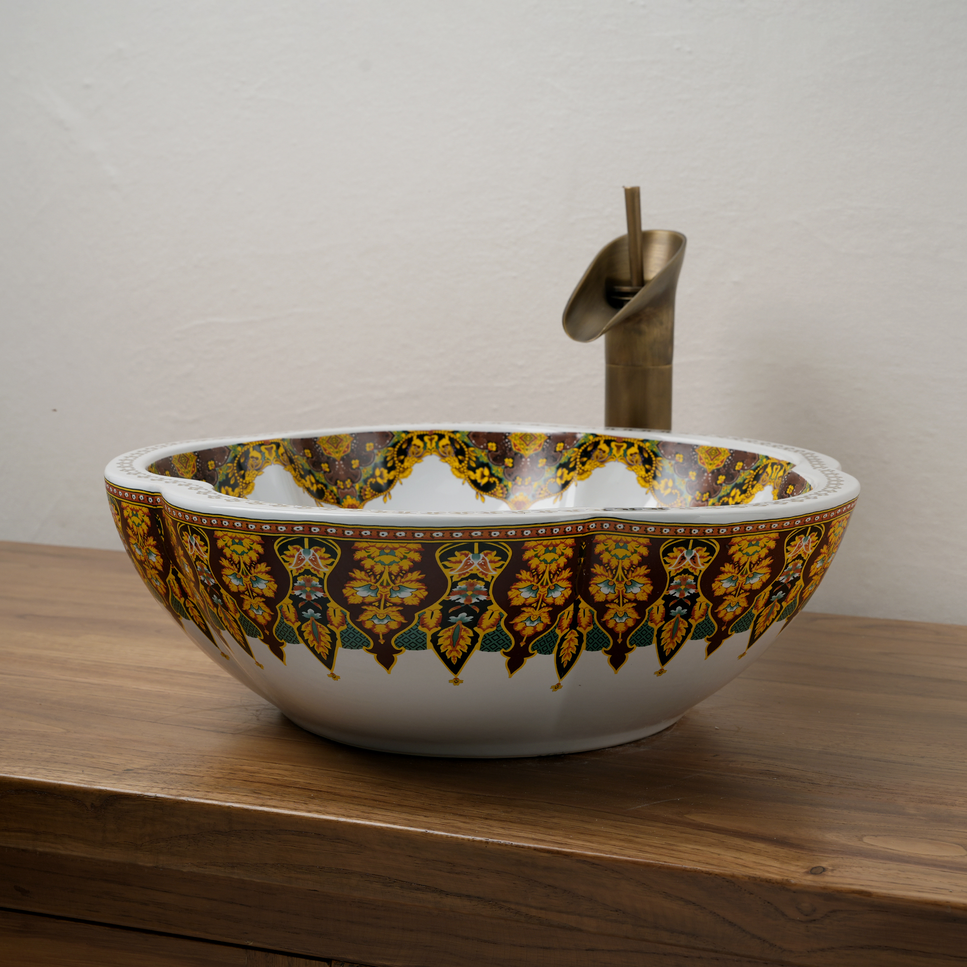 Ceramic washbasin with a yellow and white floral print