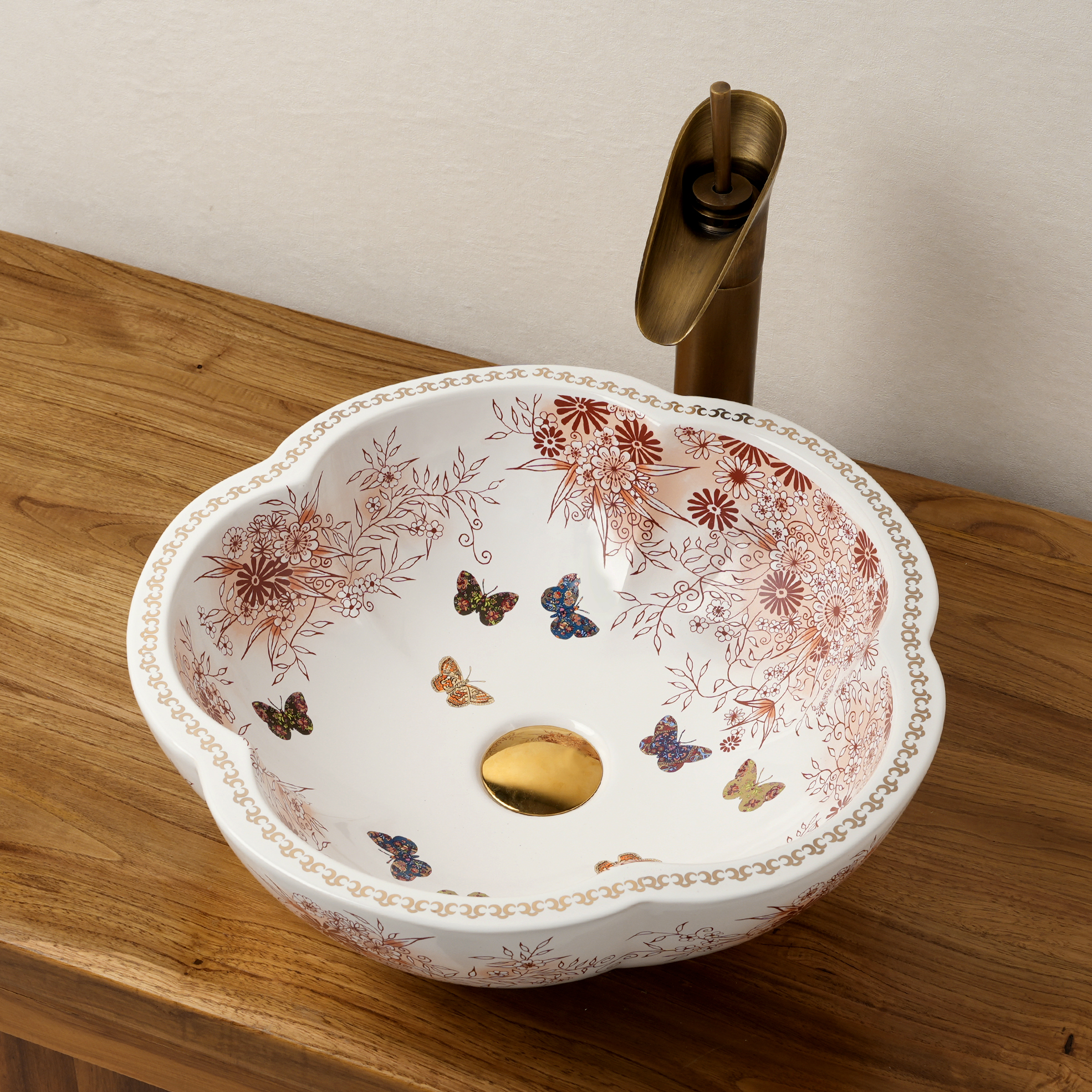 Ceramic washbasin with a pink and white floral print
