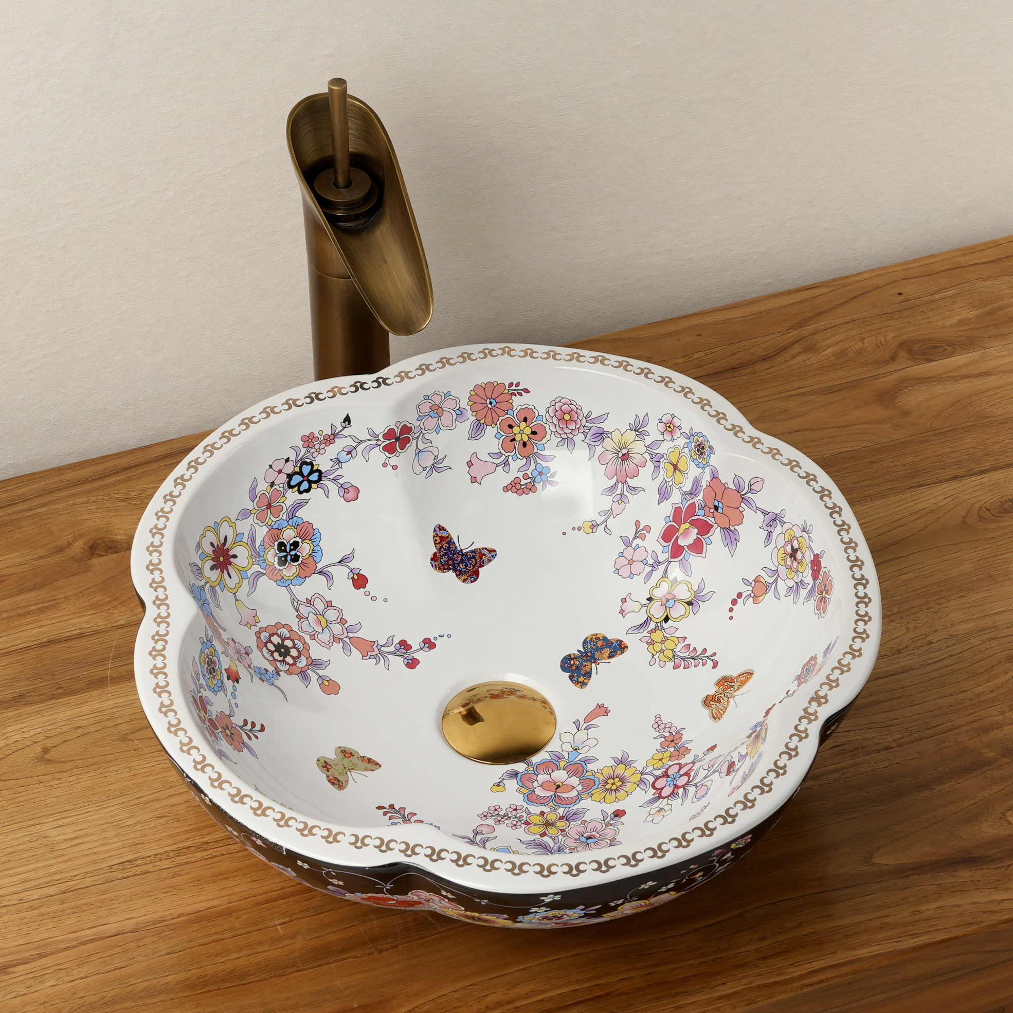 Ceramic washbasin with black and white floral print