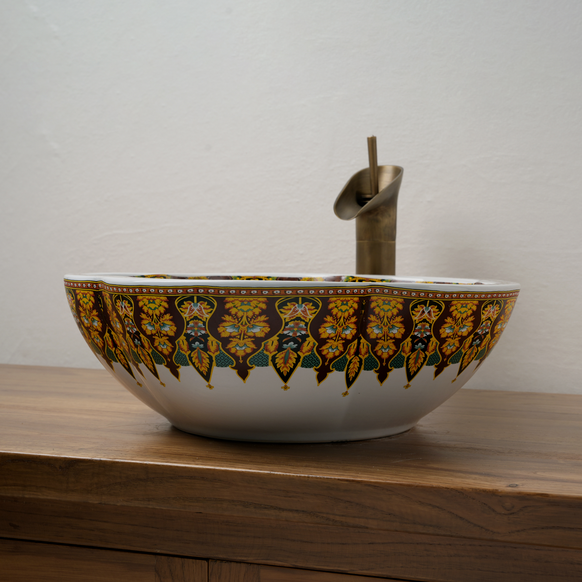 Ceramic washbasin with a yellow and white floral print