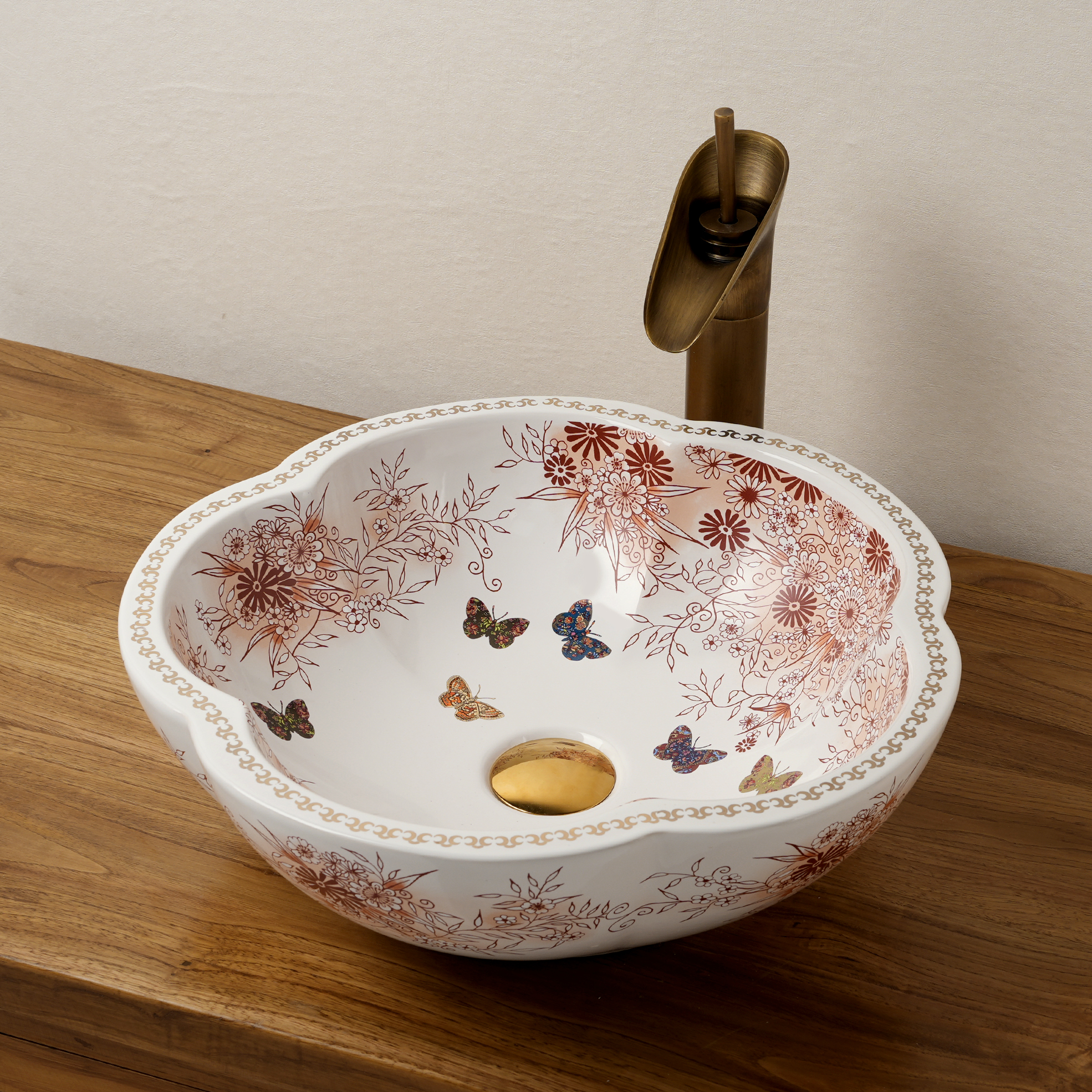 Ceramic washbasin with a pink and white floral print