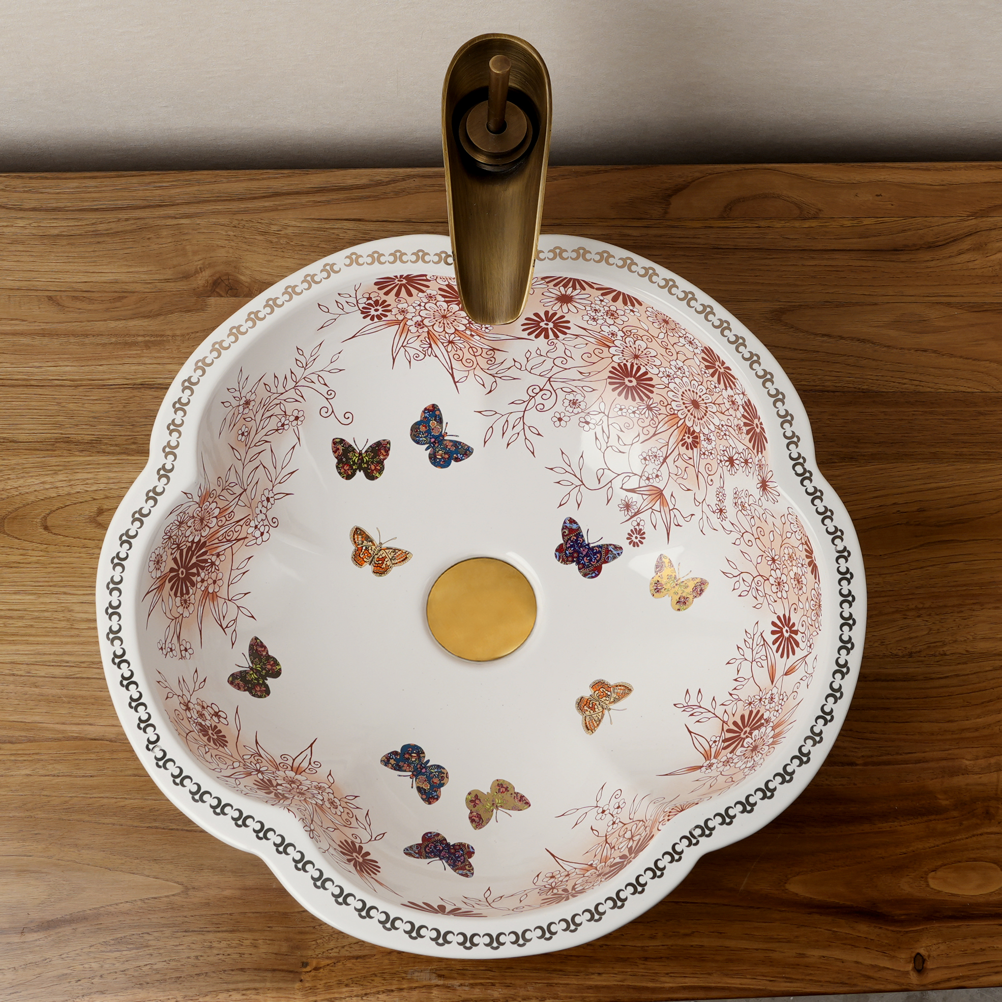 Ceramic washbasin with a pink and white floral print