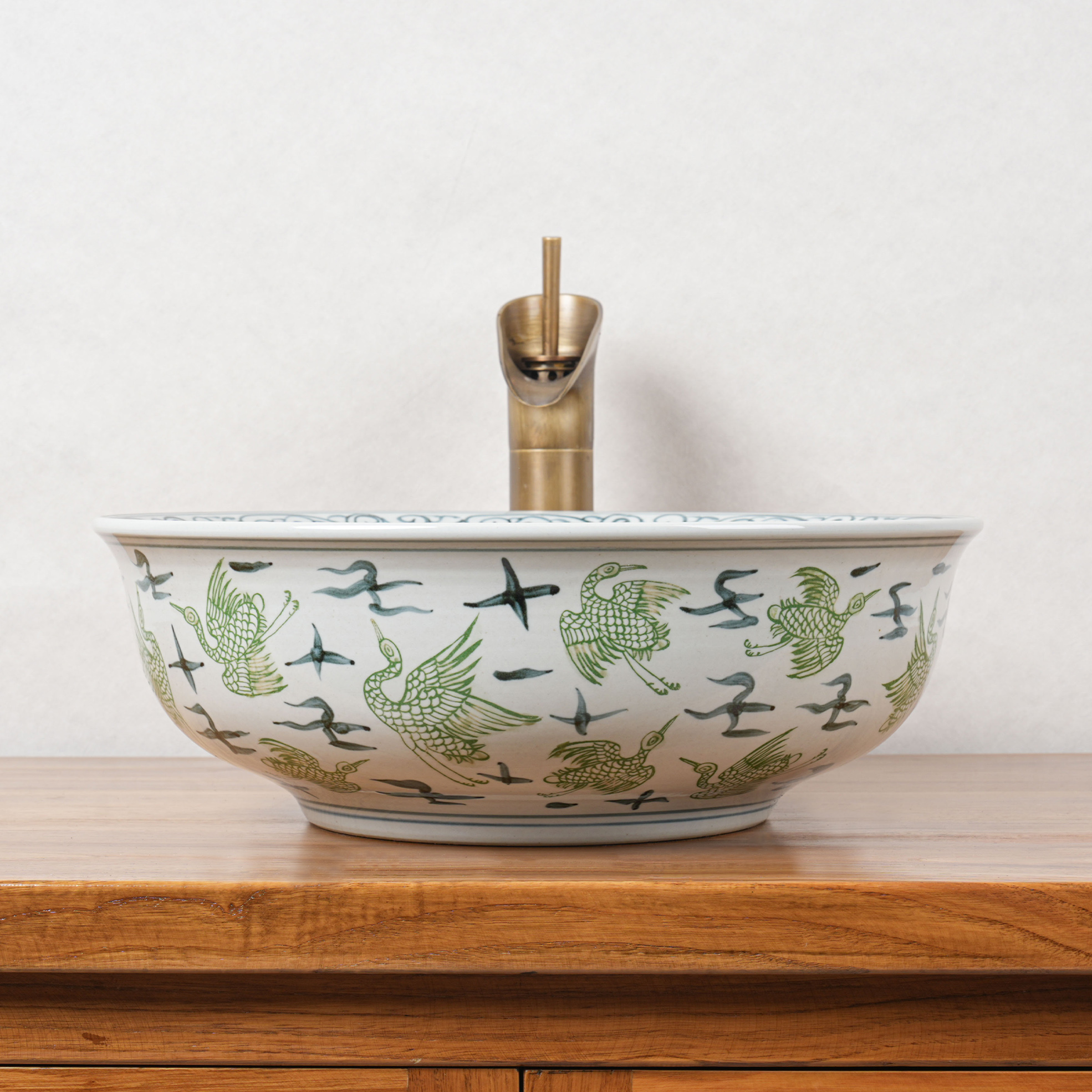Round hand-painted ceramic washbasin