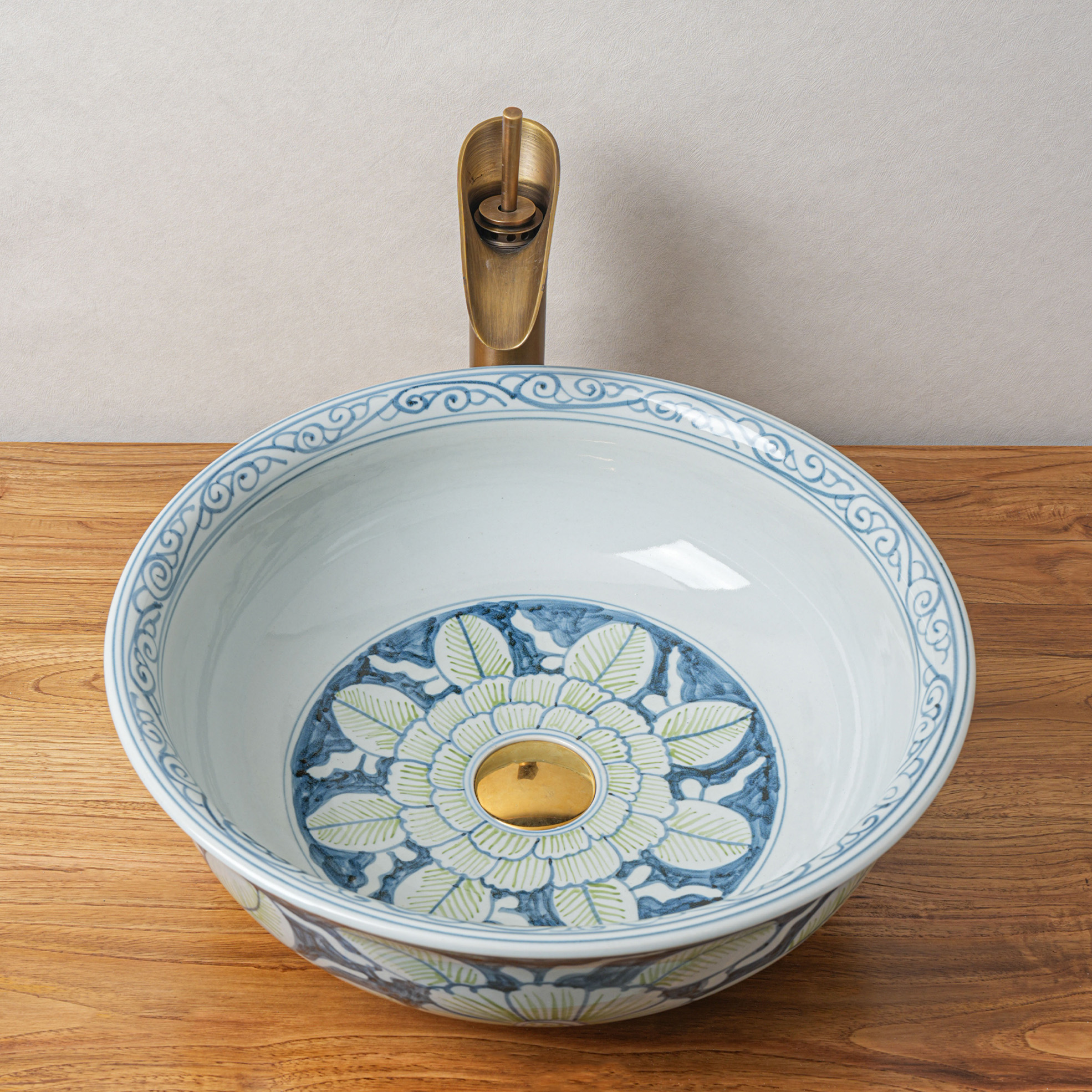 Round hand-painted ceramic washbasin