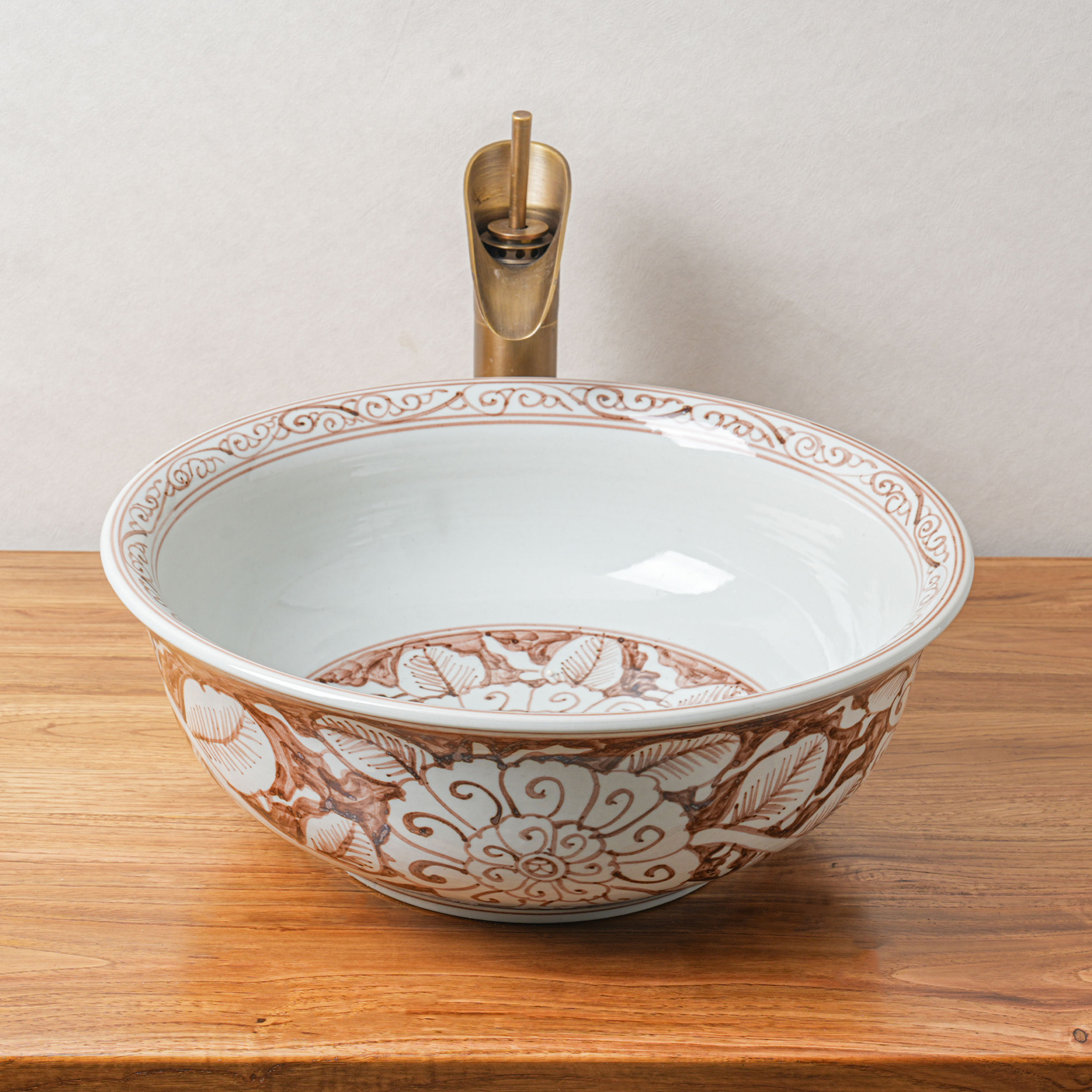 Round hand-painted ceramic washbasin