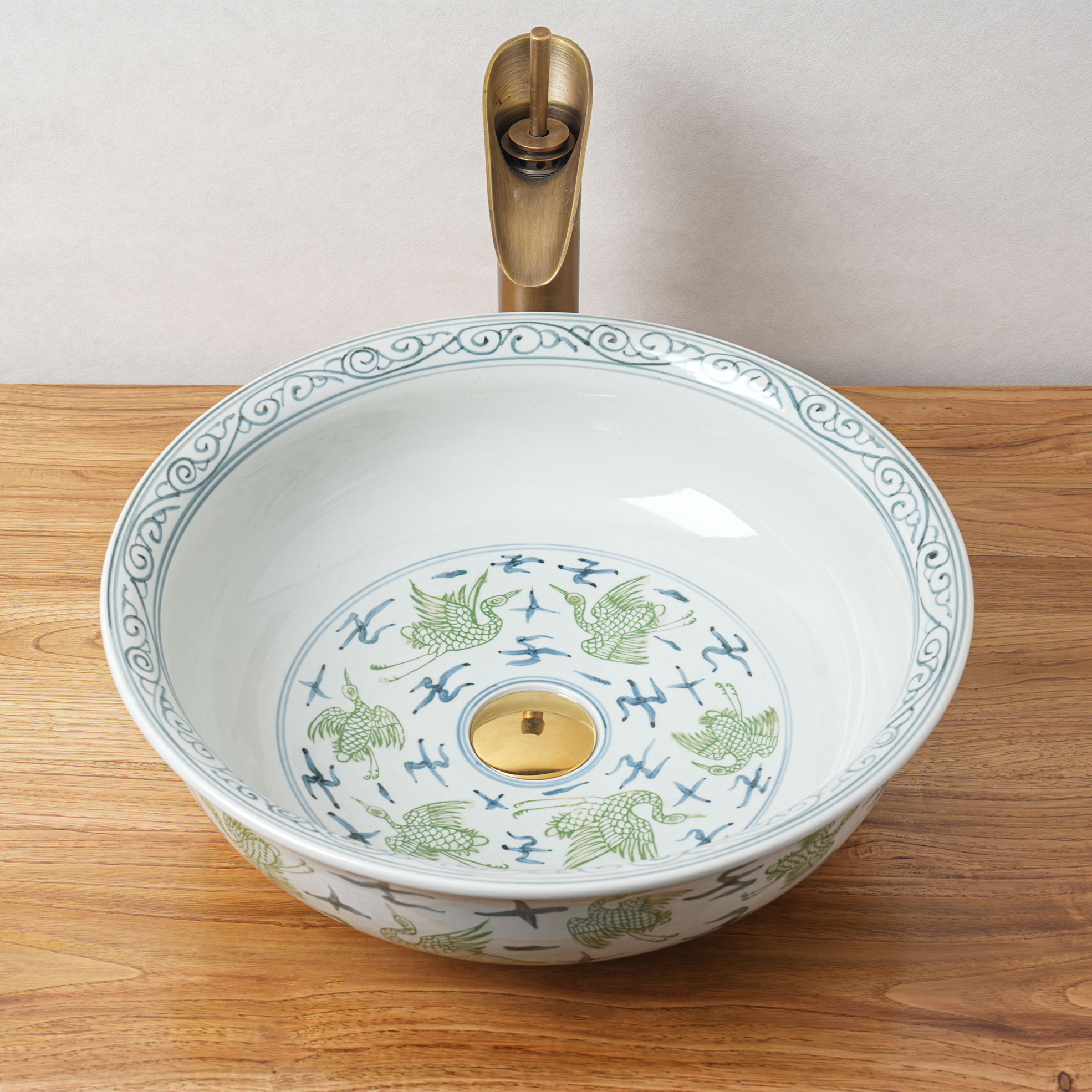 Round hand-painted ceramic washbasin
