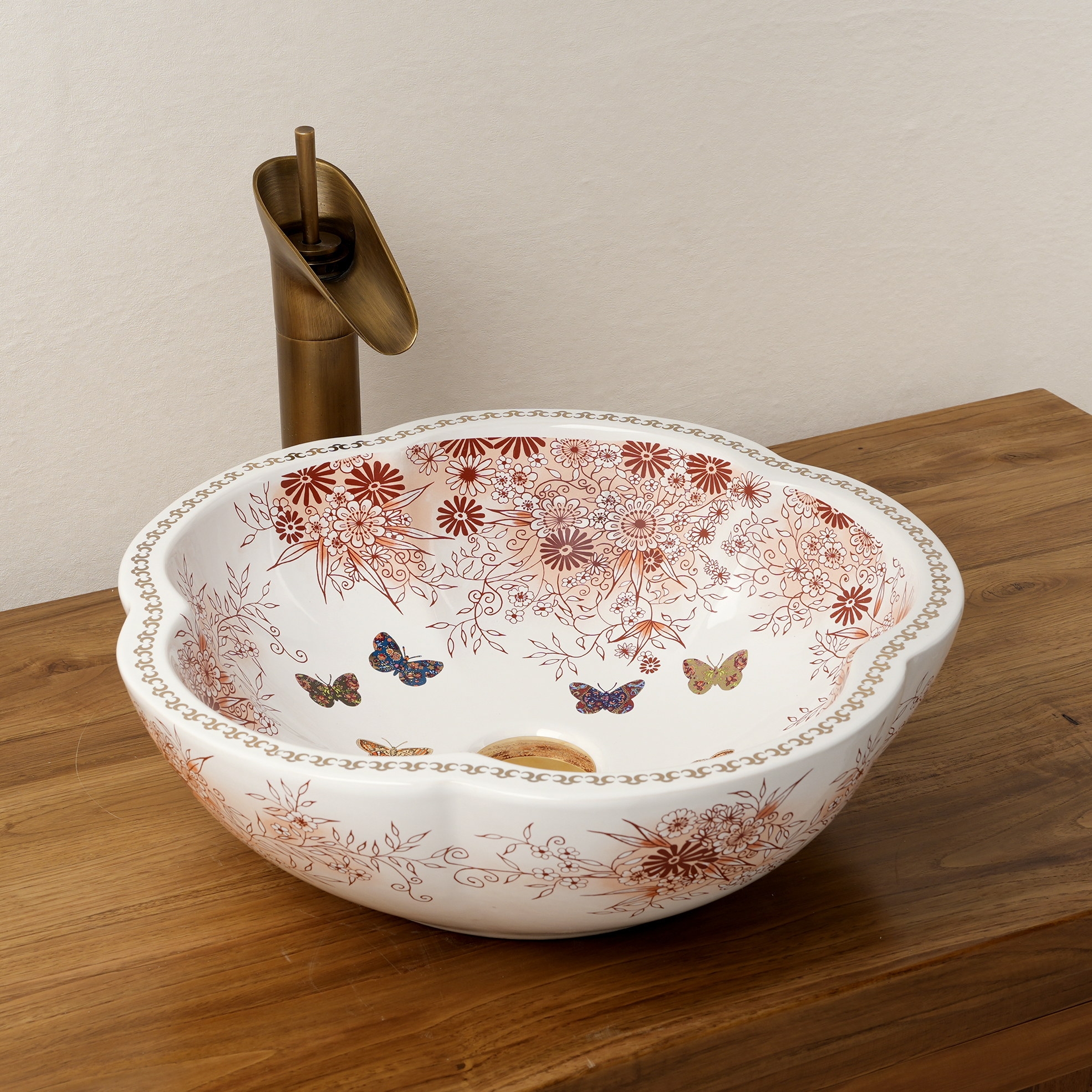 Ceramic washbasin with a pink and white floral print