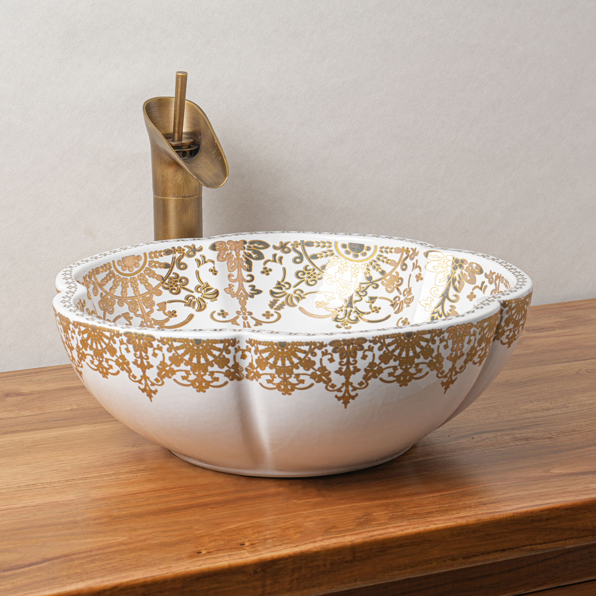 Ceramic washbasin with gold and white floral print