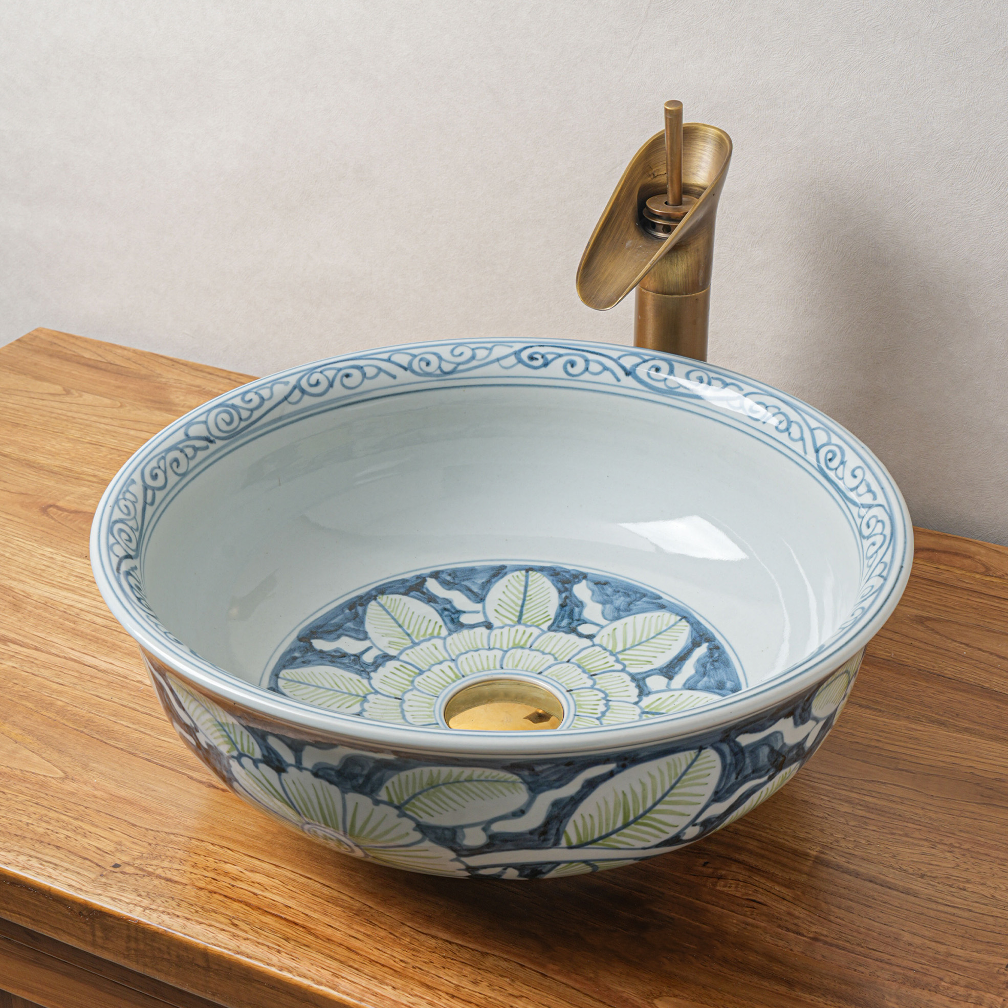 Round hand-painted ceramic washbasin