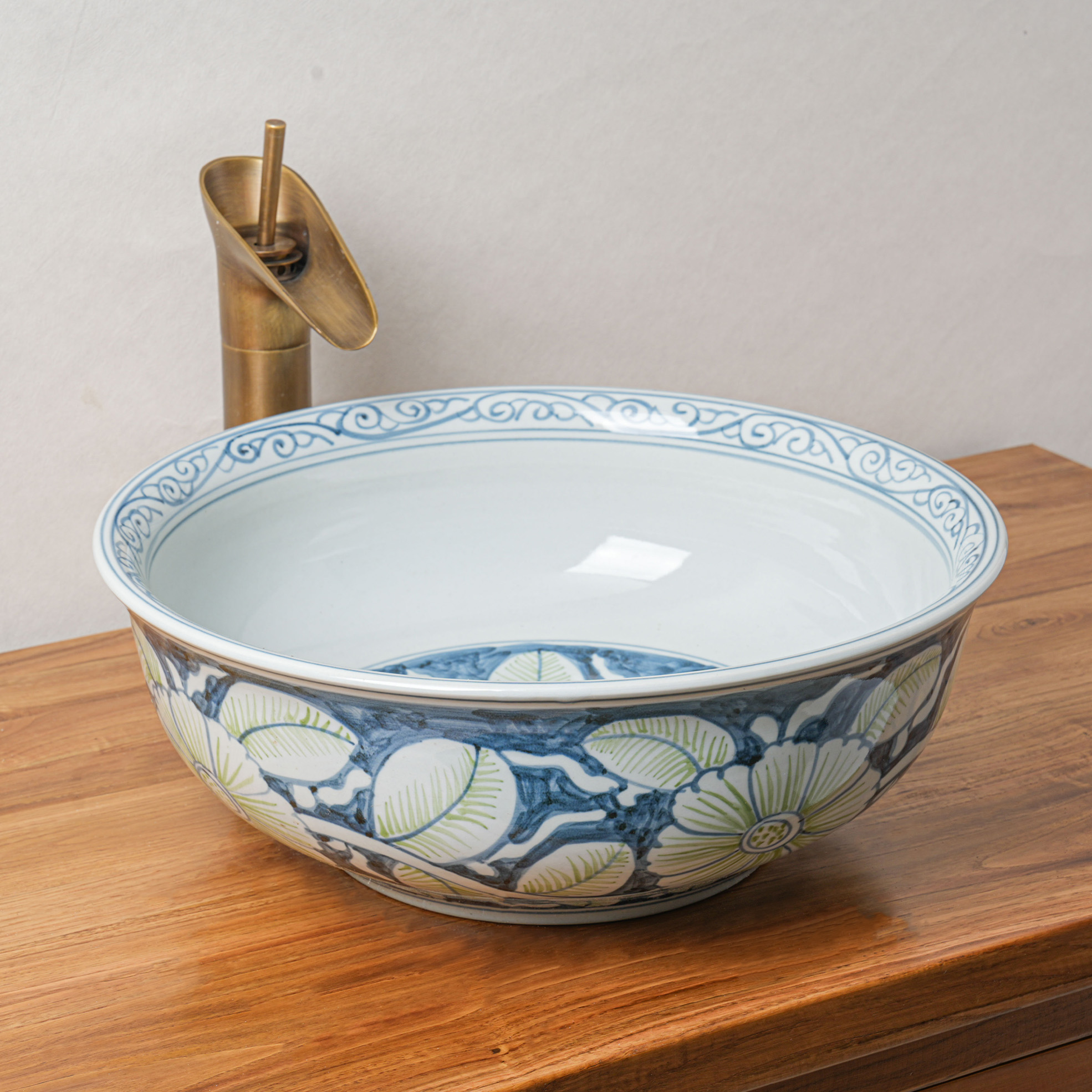 Round hand-painted ceramic washbasin