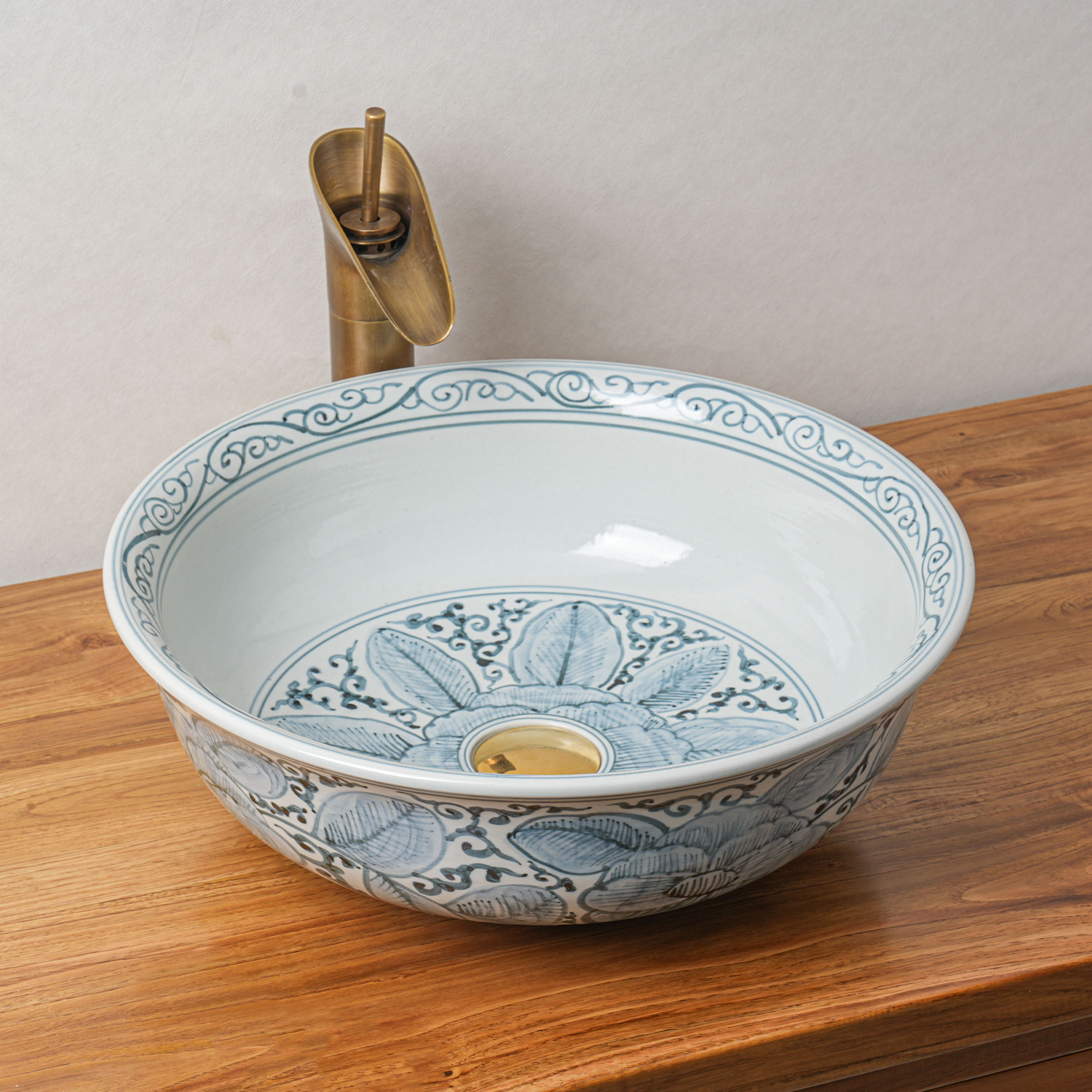 Round hand-painted ceramic washbasin