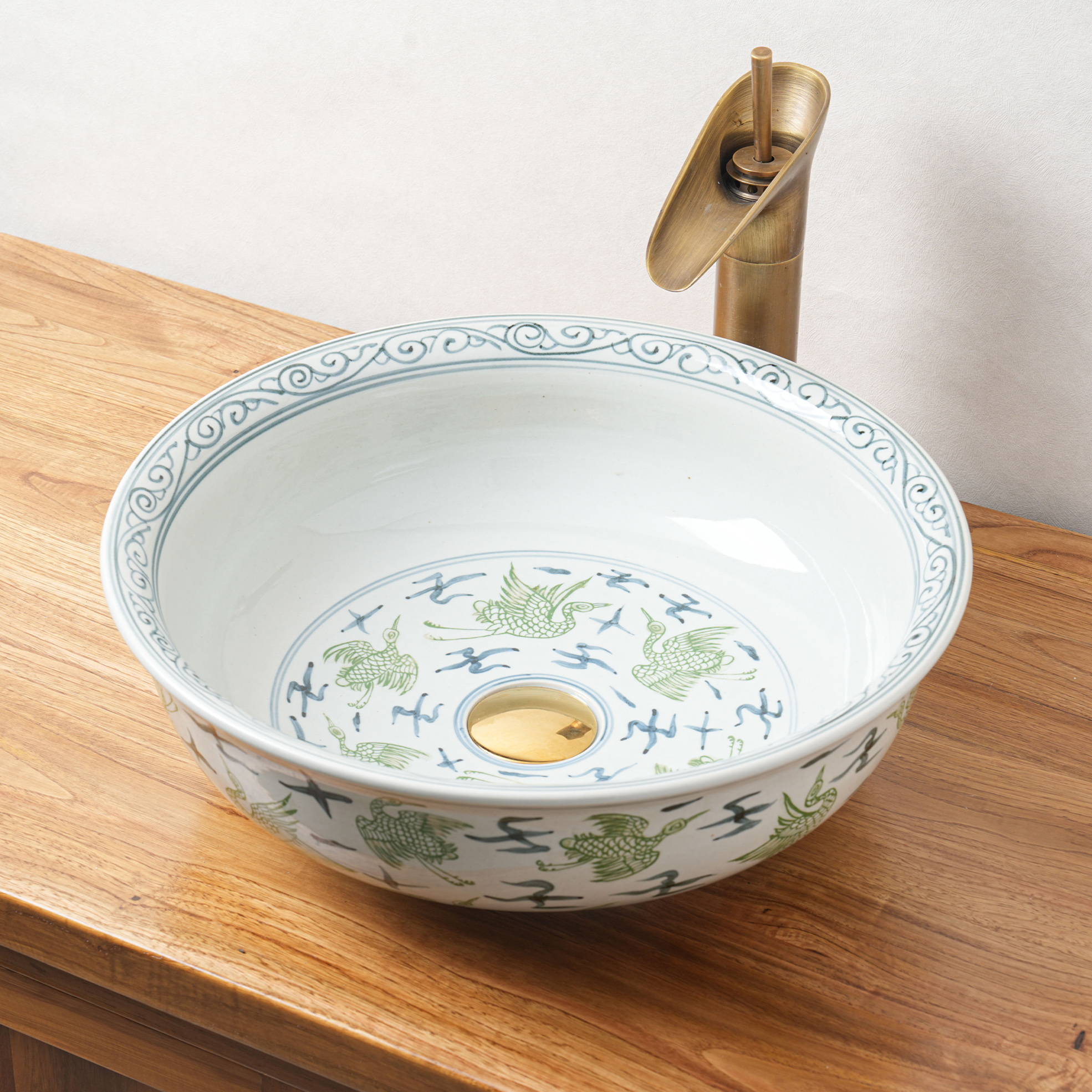 Round hand-painted ceramic washbasin