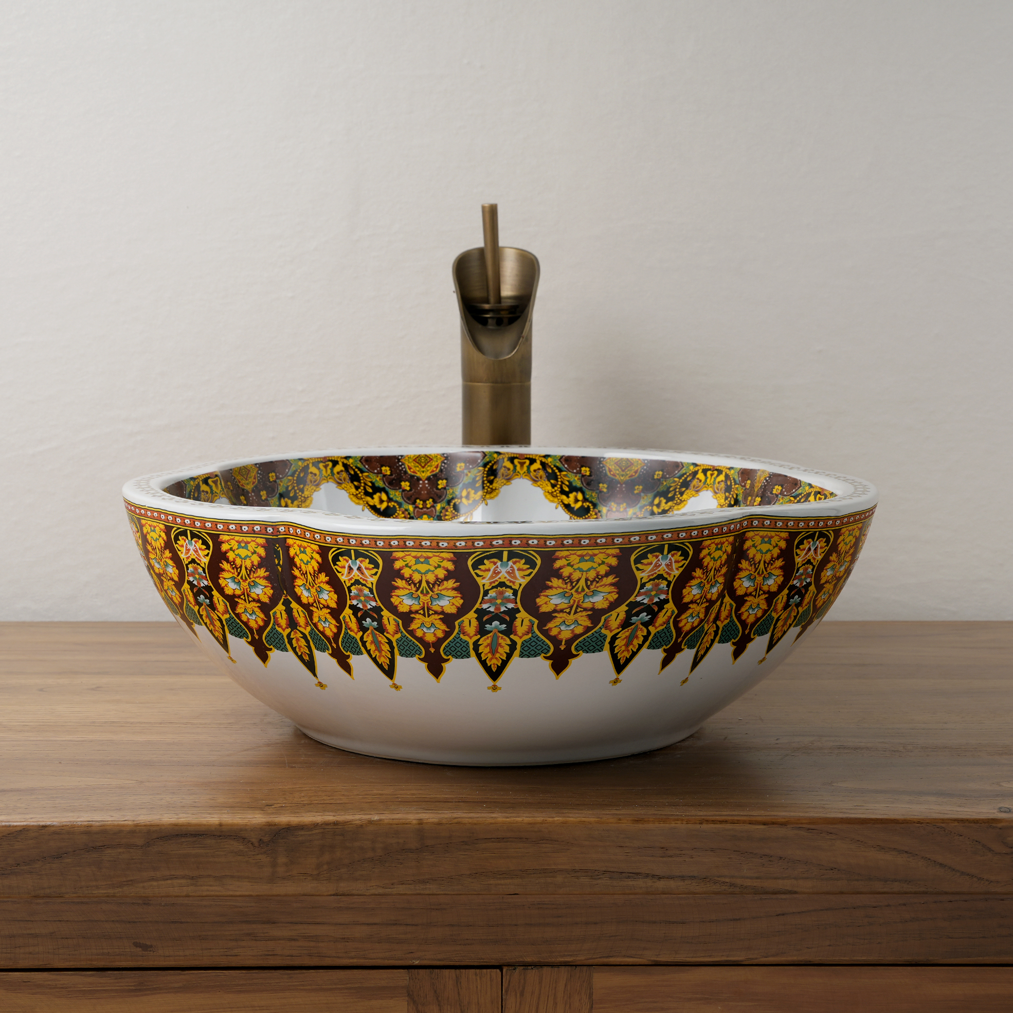 Ceramic washbasin with a yellow and white floral print