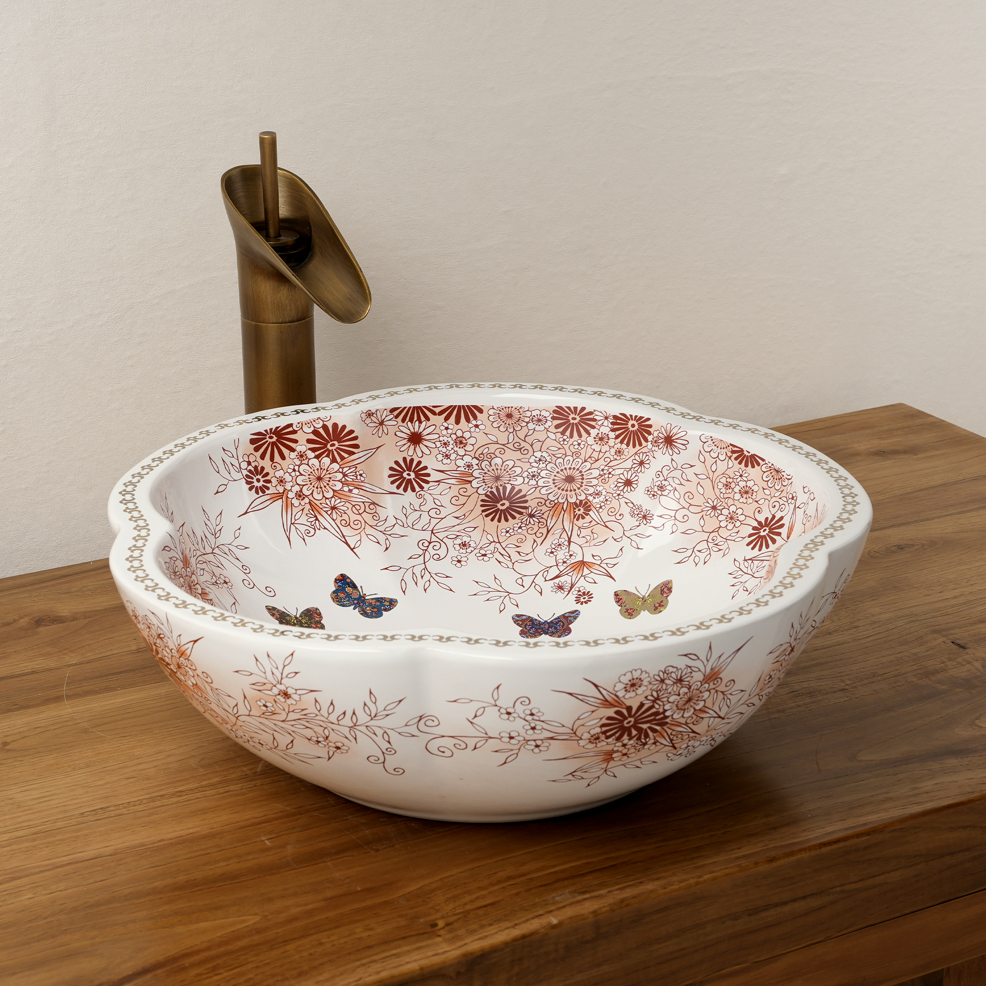Ceramic washbasin with a pink and white floral print