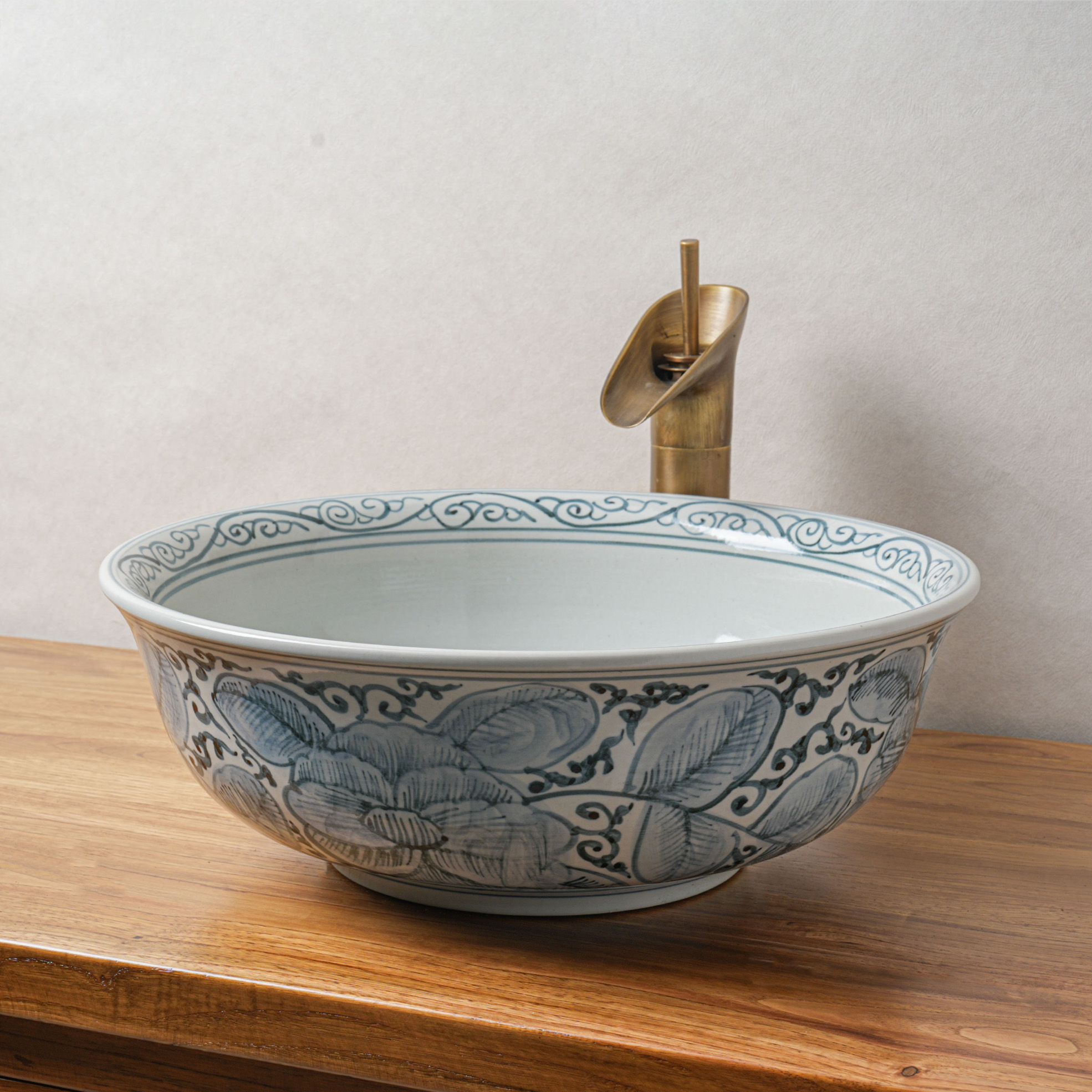 Round hand-painted ceramic washbasin