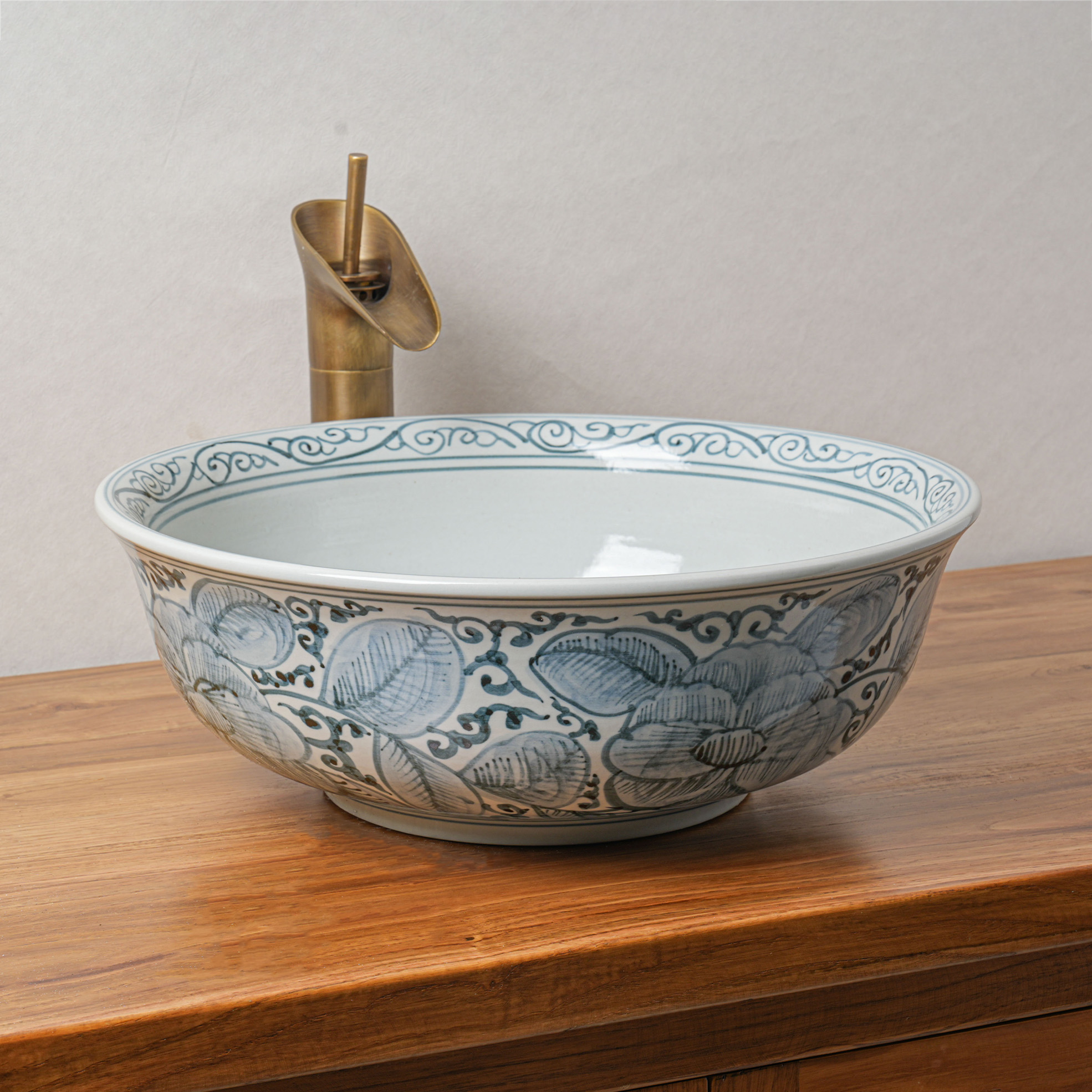 Round hand-painted ceramic washbasin