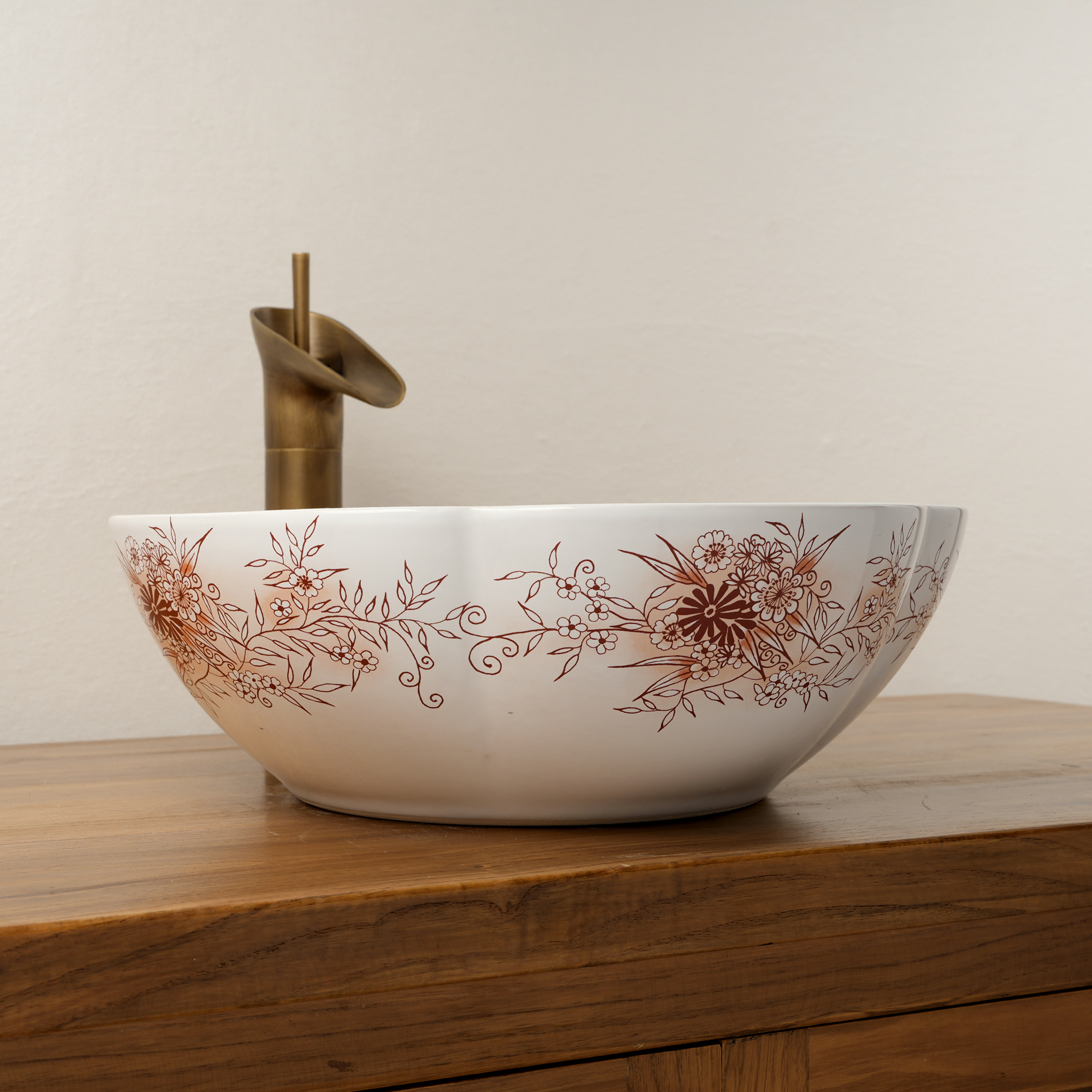 Ceramic washbasin with a pink and white floral print