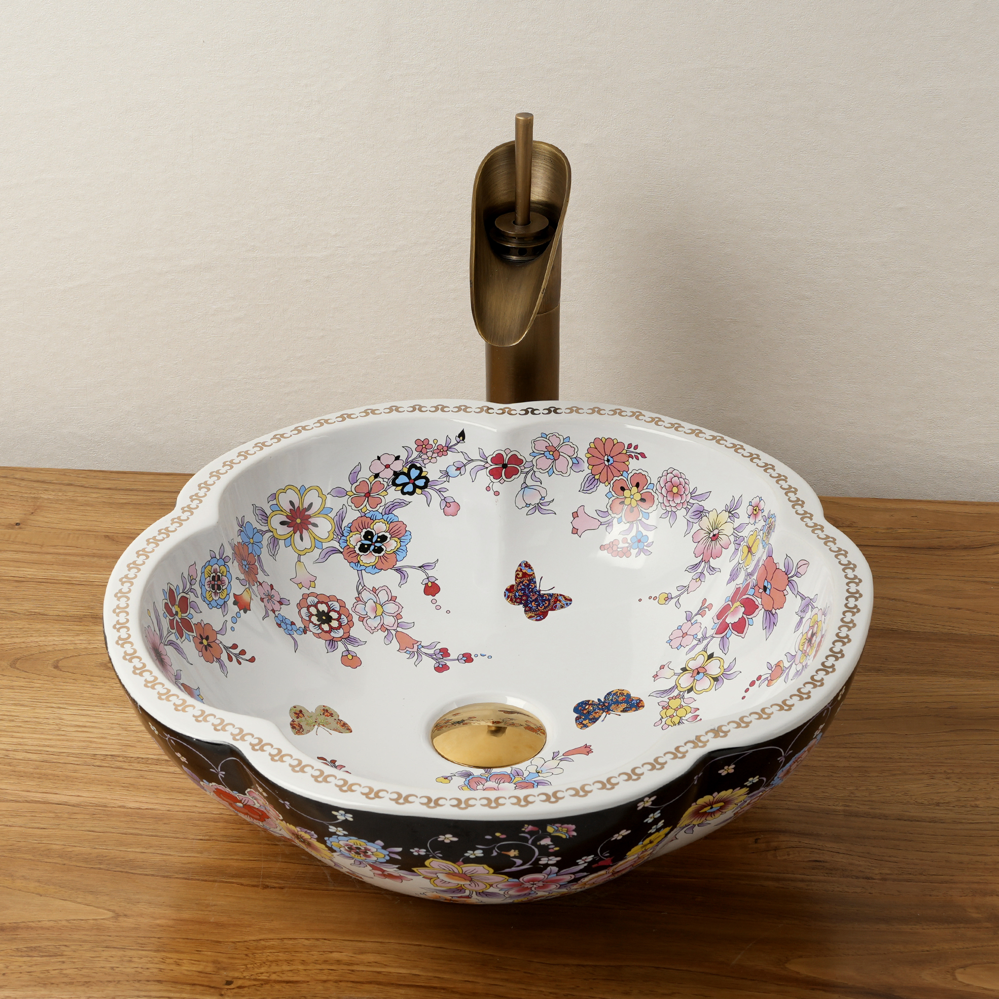 Ceramic washbasin with black and white floral print