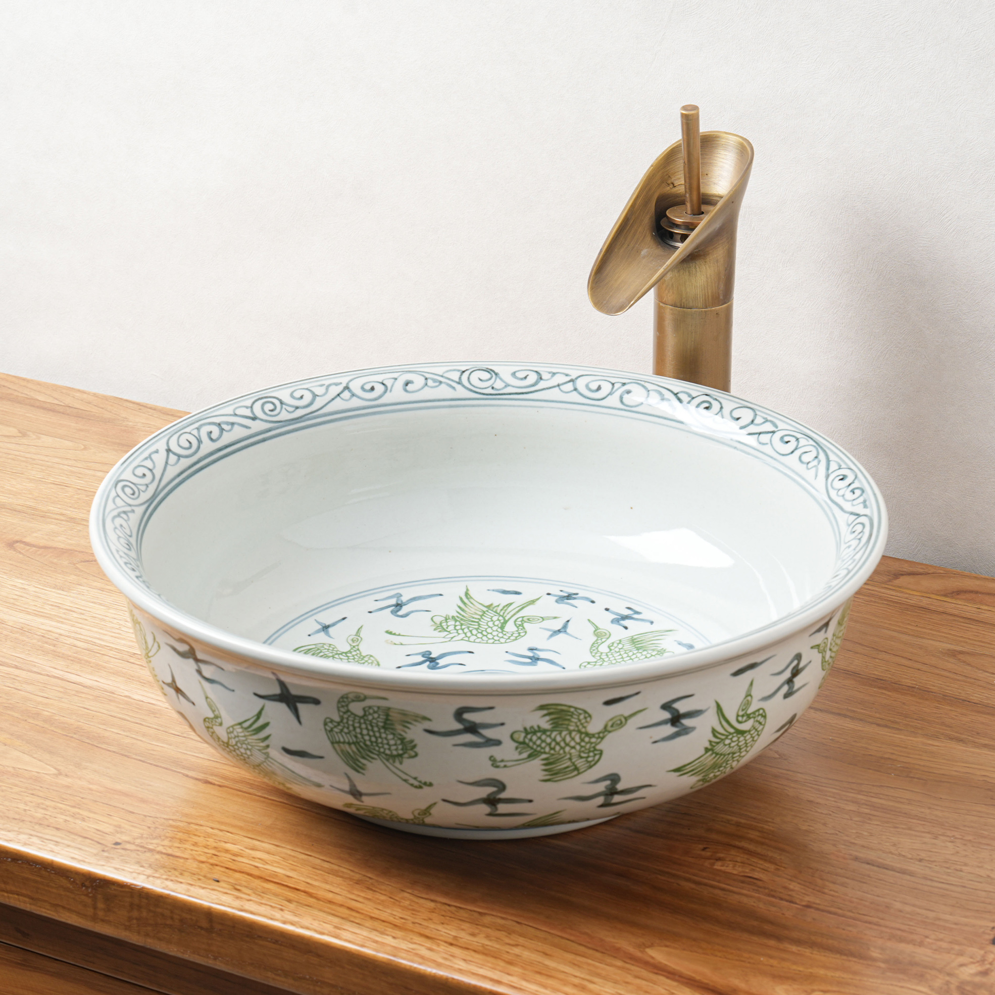 Round hand-painted ceramic washbasin
