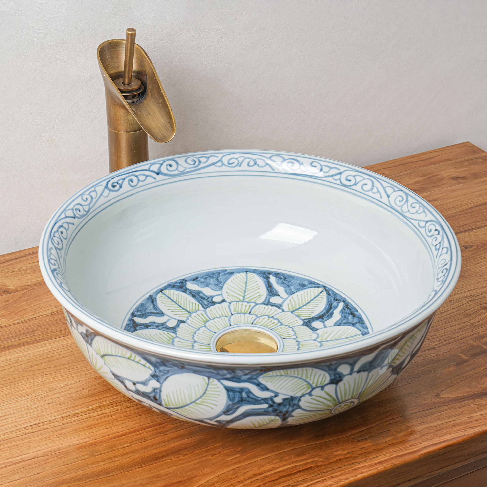 Round hand-painted ceramic washbasin