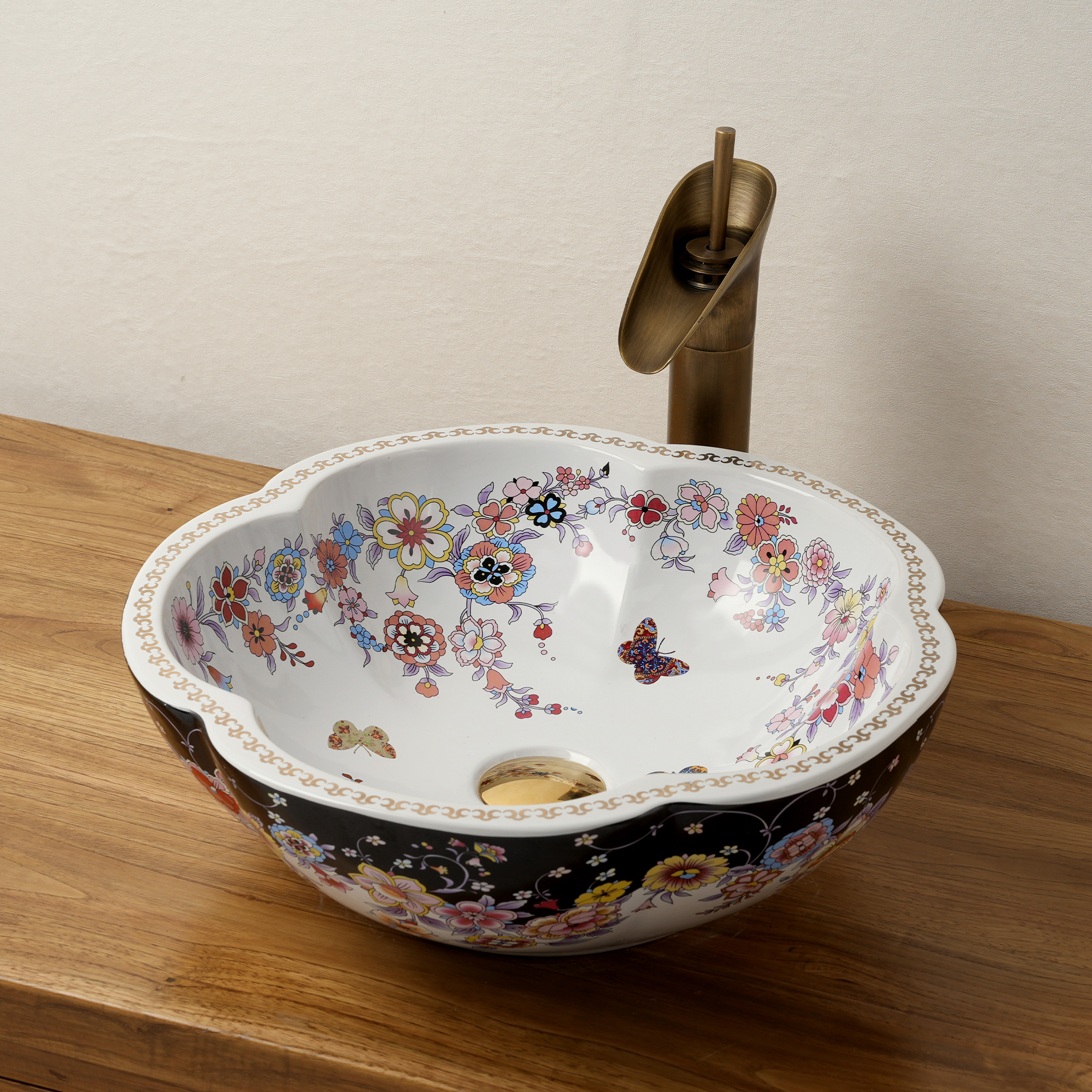 Ceramic washbasin with black and white floral print