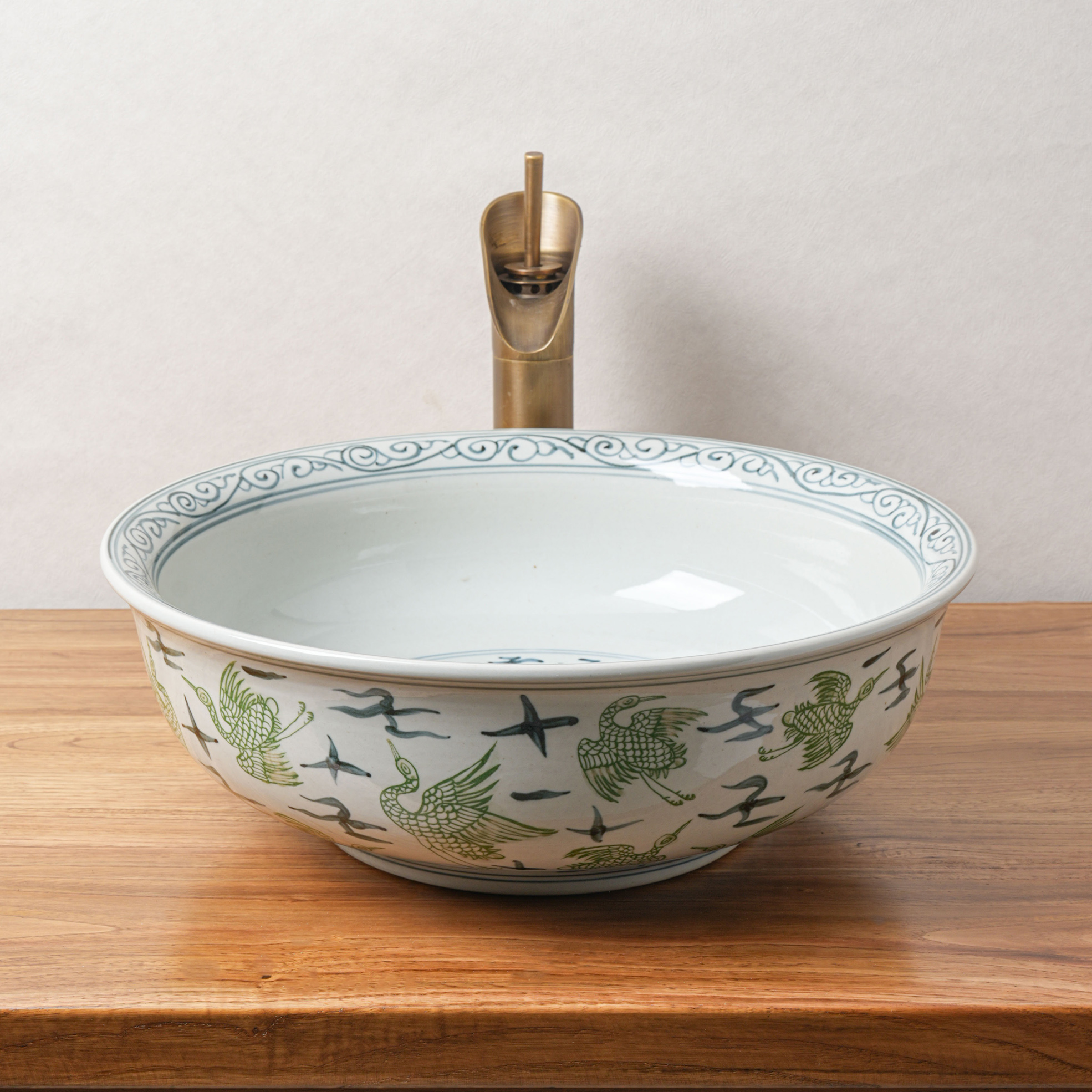 Round hand-painted ceramic washbasin