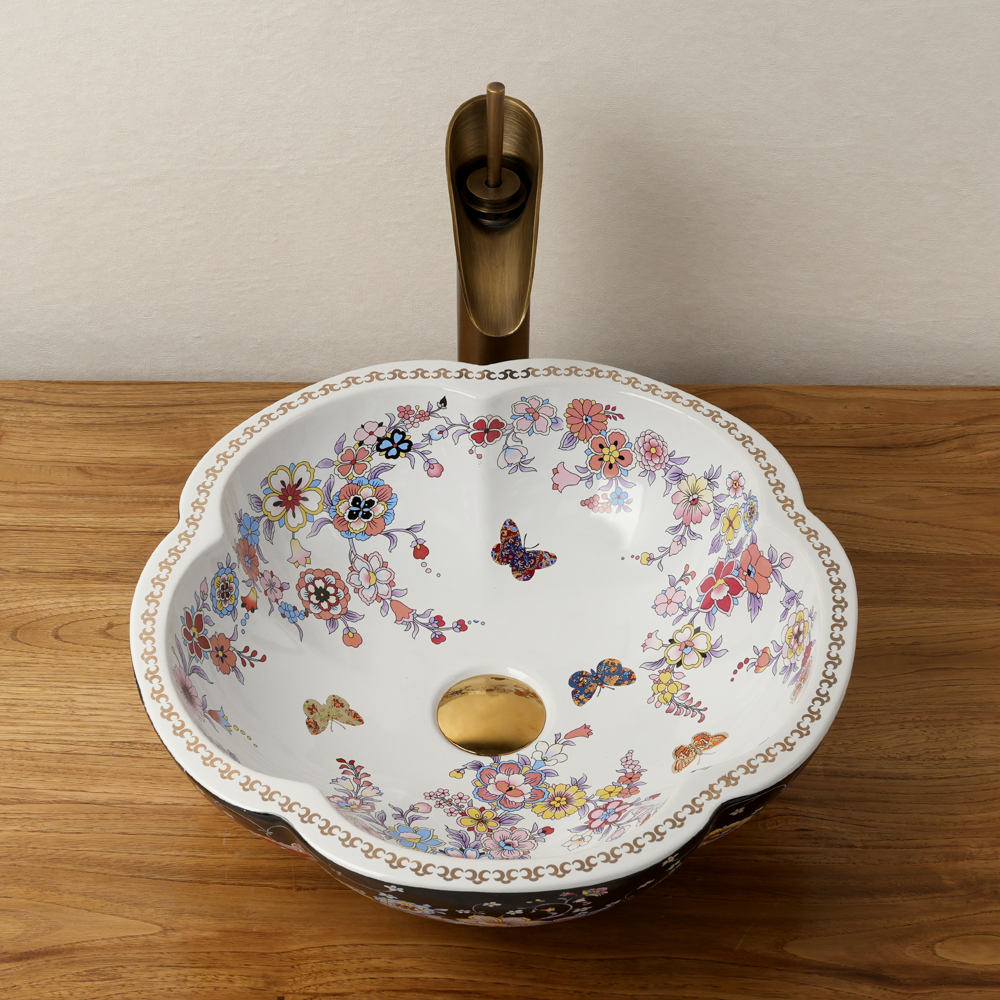 Ceramic washbasin with black and white floral print